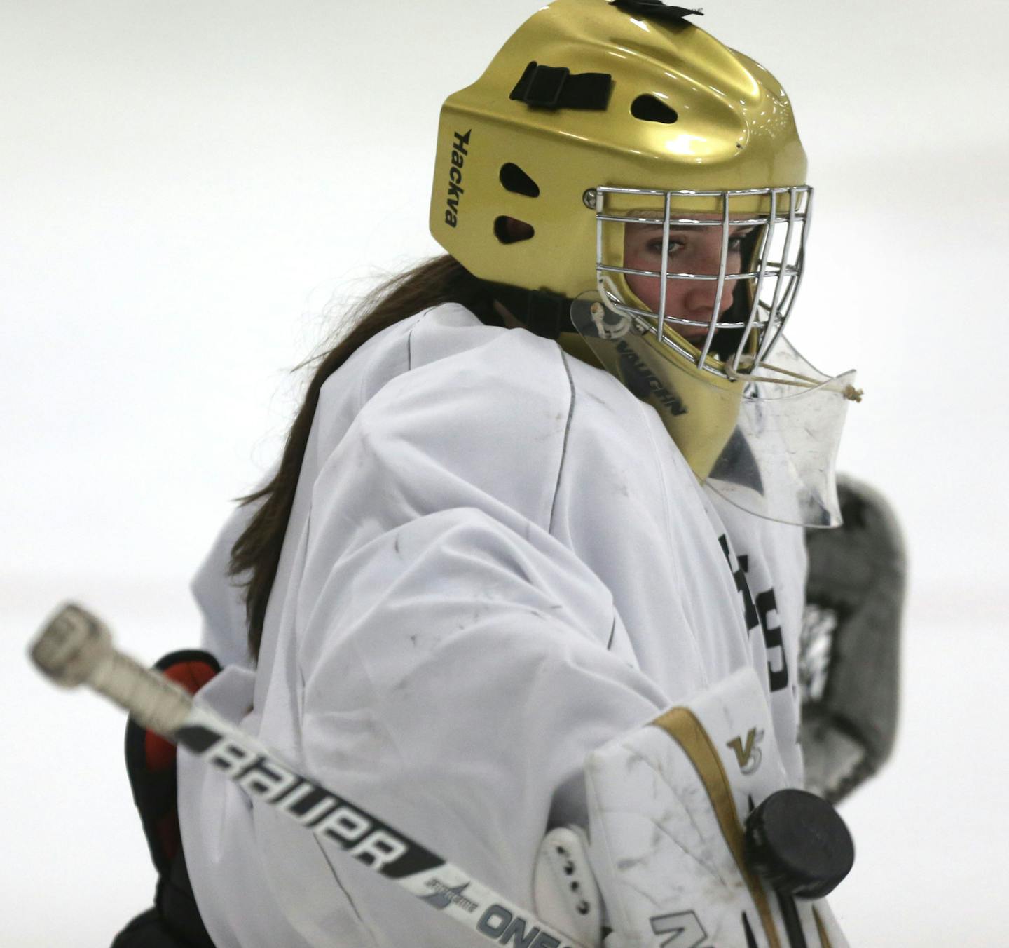 Andover goalie Maddie Rooney blocks the shot of her teammates during practice at the Andover Community Center Ice Rink in Andover, Min., Thursday, November 14, 2013 ] (KYNDELL HARKNESS/STAR TRIBUNE) kyndell.harkness@startribune.com