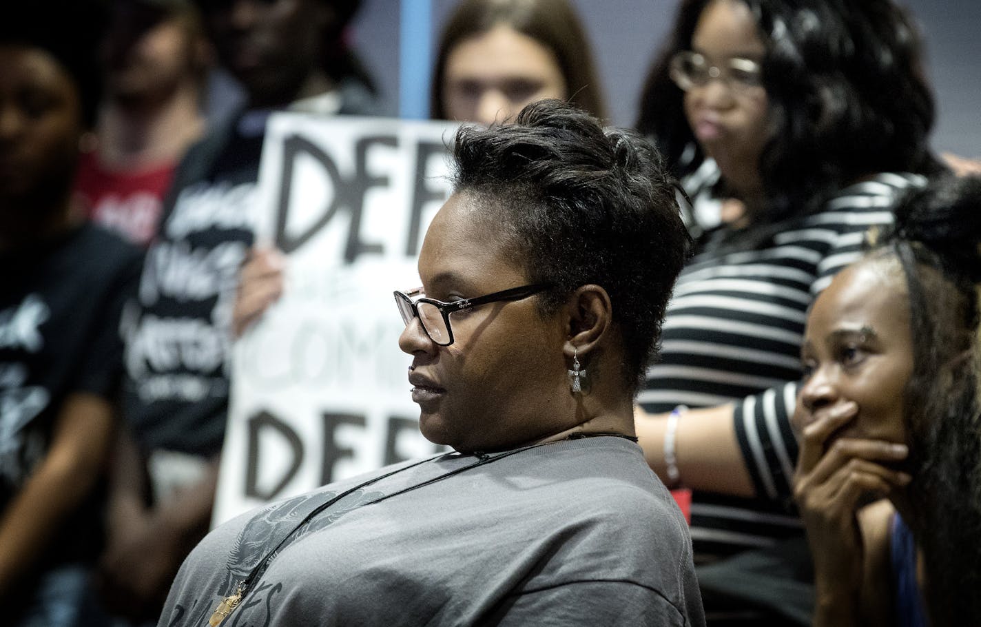 Naomi Thompson mother of Khaleel Thompson listened to a demonstrator speak at a Crystal city council meeting. ] CARLOS GONZALEZ &#xef; cgonzalez@startribune.com - June 6, 2017, Crystal, MN, Family and friends of Khaleel Thompson, who was shot by Crystal police May 24, rally at city hall, demanding action against the police who shot Thompson. Thompson remains in critical condition. Police say he waved a toy gun at them. The rally is organized by various groups including Black LIves Matter St. Pau