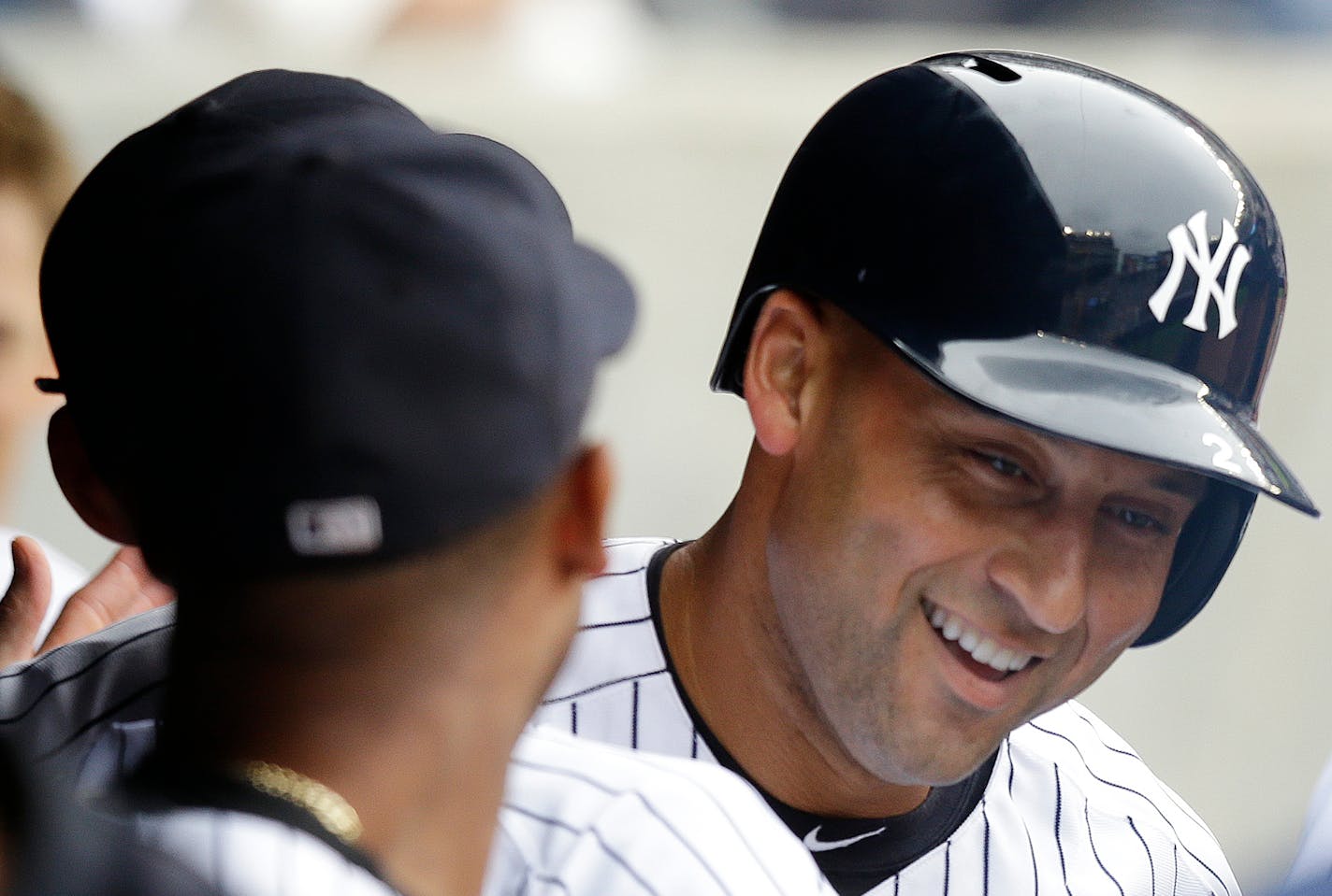 A teammate congratulated Yankees shortstop Derek Jeter, who hit a first-inning solo home run off Tampa Bay's Matt Moore on Sunday.