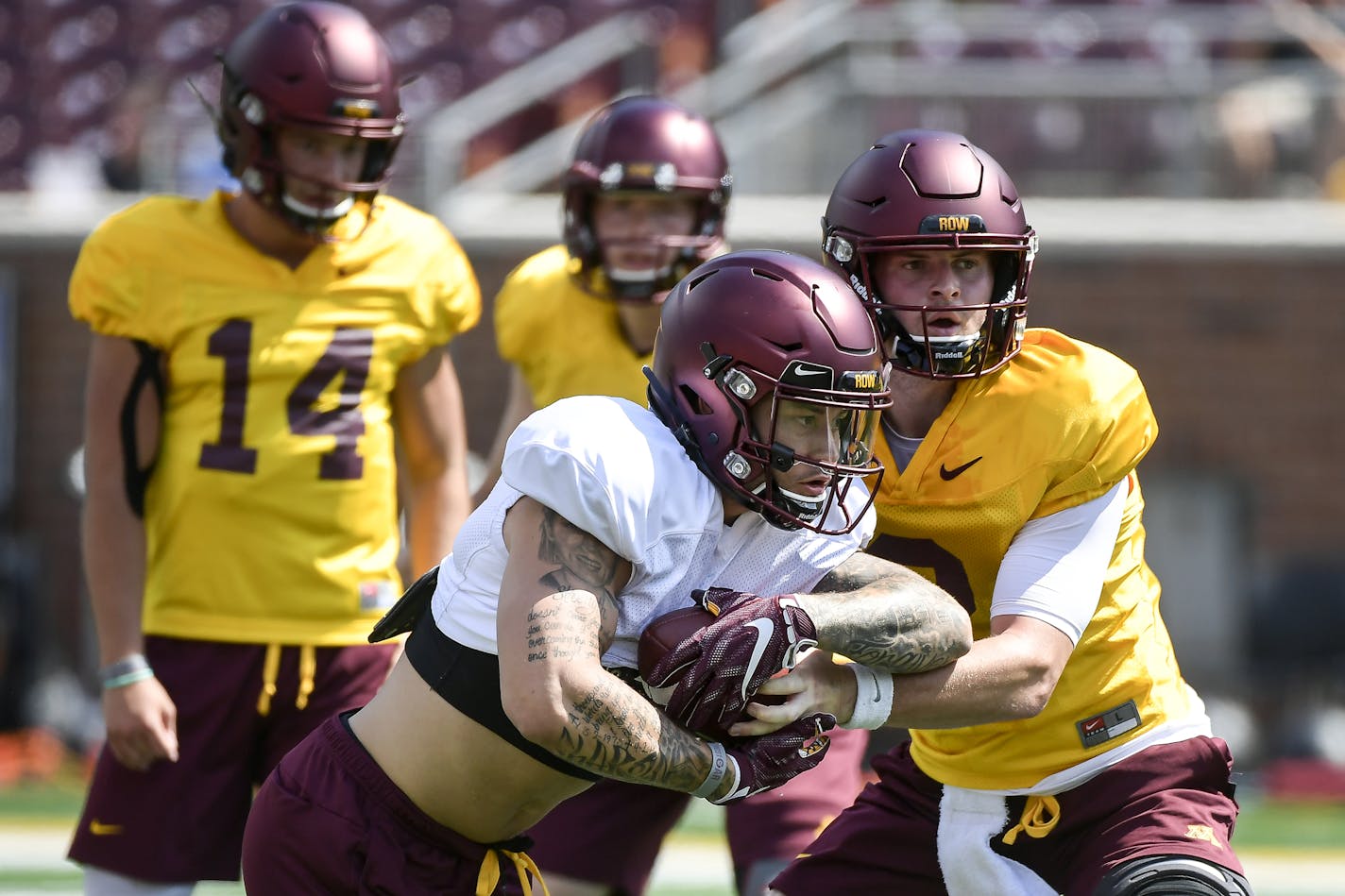 Minnesota Golden Gophers quarterback Tanner Morgan (2) handed off the ball to running back Shannon Brooks (4) during practice Saturday. ] Aaron Lavinsky &#xa5; aaron.lavinsky@startribune.com The University of Minnesota Golden Gophers football team held an open practice on Saturday, Aug. 3, 2019 at TCF Bank Stadium in Minneapolis, Minn.