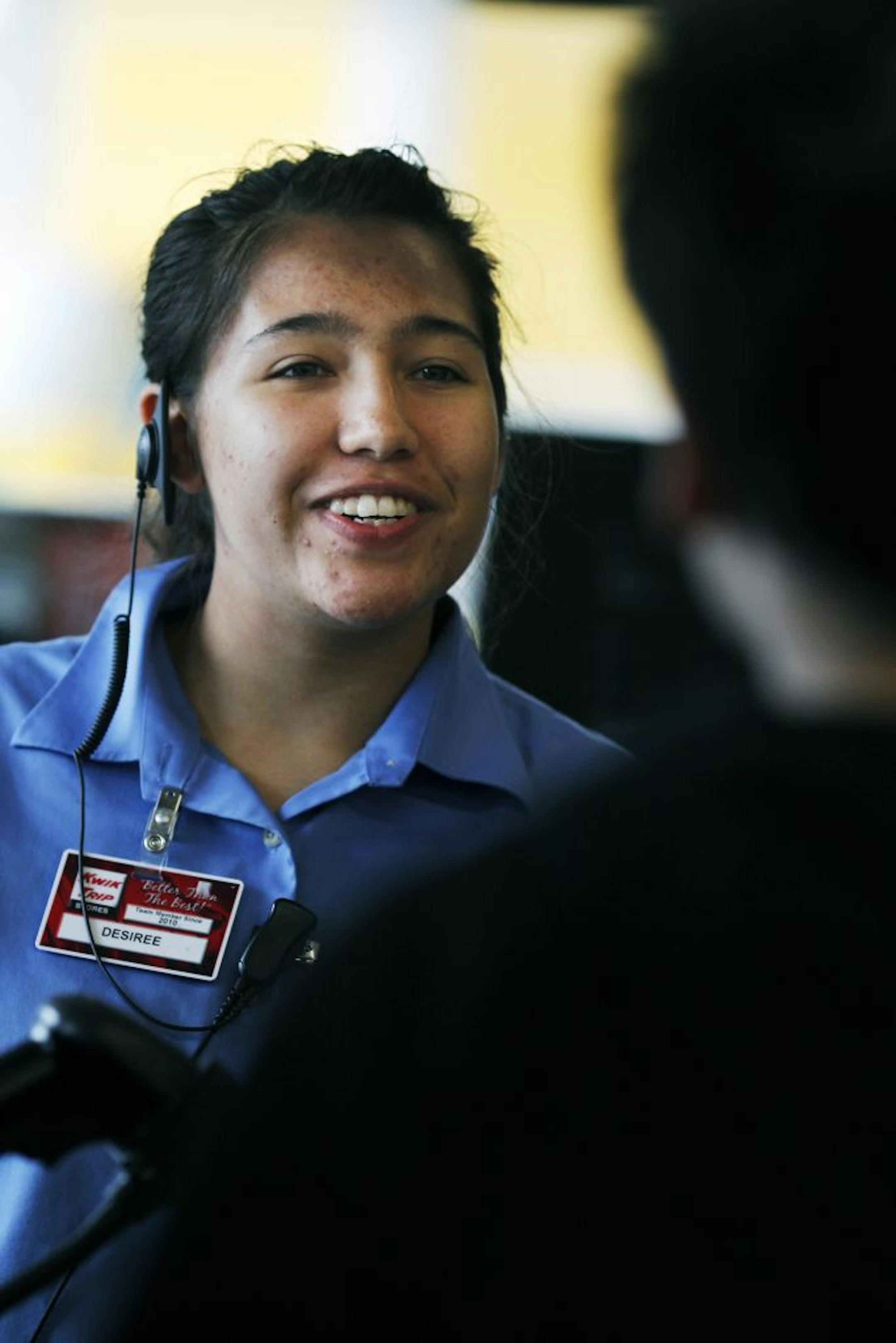 At the Kwik Trip store, cashier Desiree Goret helps a customer. "It's a really good environment," says Goret who is on summer break from college.