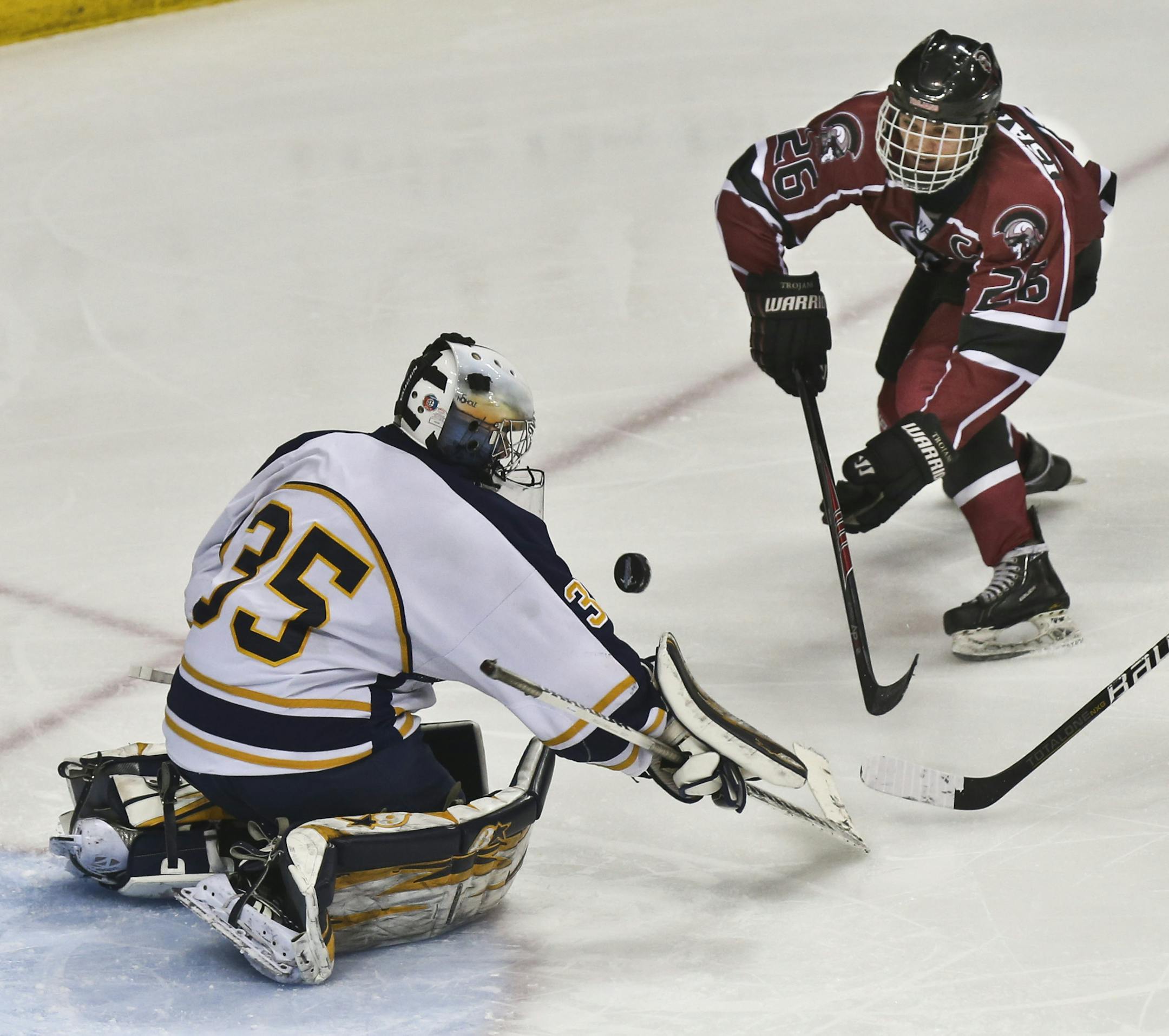 Hermantown goalie Adam Smith blocked a head on shot from New Prague's Austin Isaacson in the third period during the State Boys hockey Tournament 1A semifinals between New Prague and Hermantown in St. Paul, Minn., on Friday, March 7, 2014. Hermantown won 4-2. ] (RENEE JONES SCHNEIDER • reneejones@startribune.com)