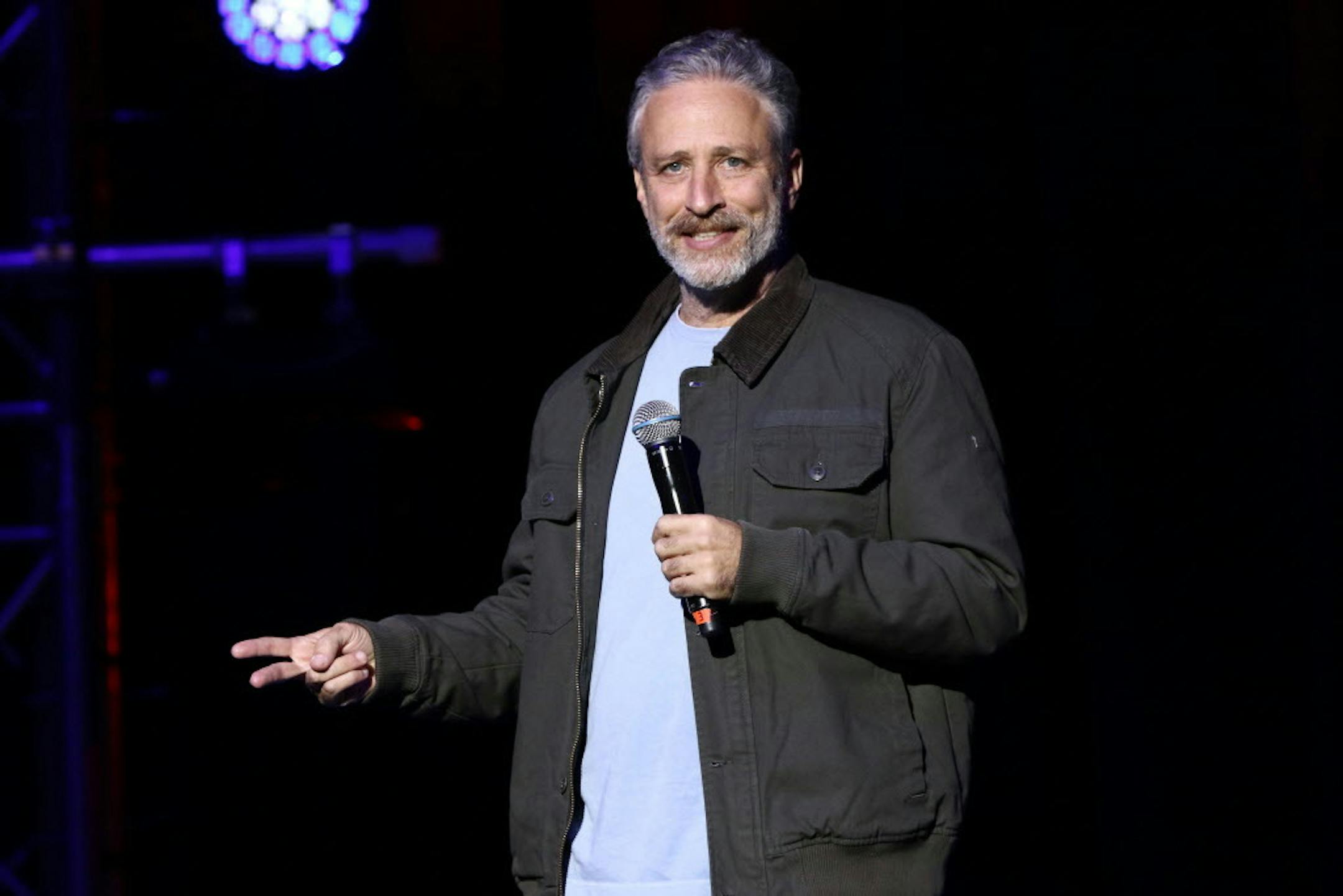 FILE - In this Tuesday, Nov. 10, 2015, file photo, comedian Jon Stewart performs at the 9th Annual Stand Up For Heroes event, in New York. Stewart delivered a riff reminiscent of his "Daily Show" days during an appearance on CBS' "Late Show with Stephen Colbert" on July 21, 2016. (Photo by Greg Allen/Invision/AP, File) ORG XMIT: MIN2016072610414313