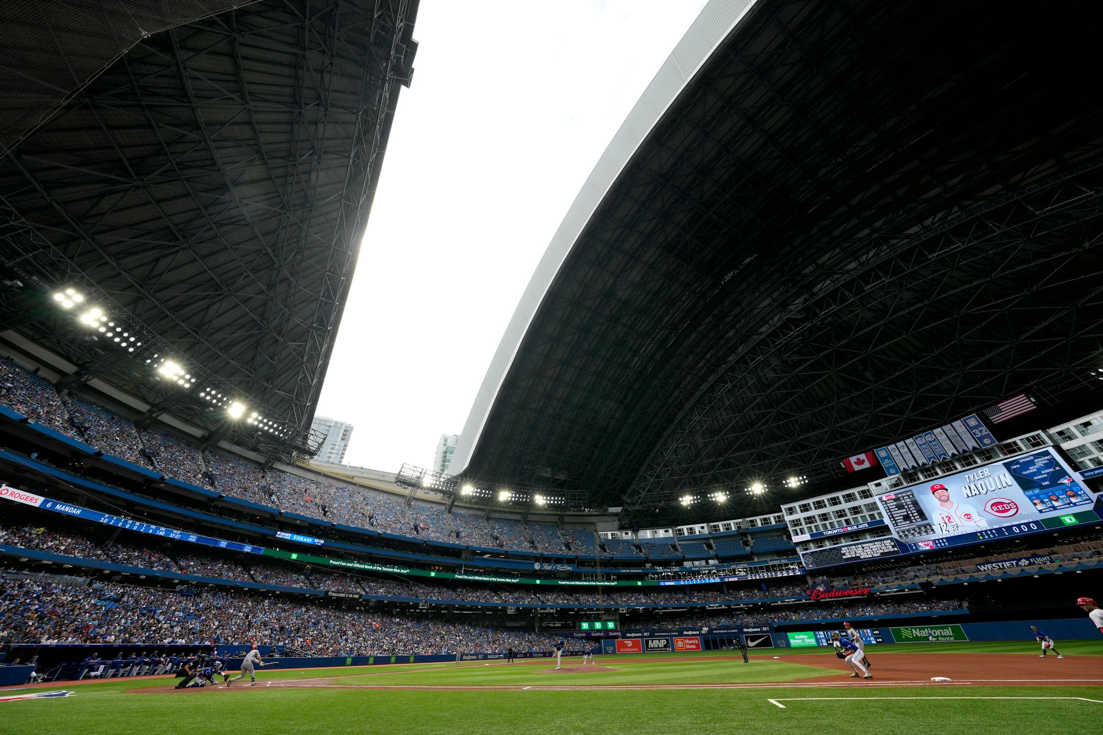 The roof is opened at the Rogers Centre following a storm that passed over the city during the fourth inning of a baseball game between the Toronto Blue Jays and the Cincinnati Reds in Toronto, Saturday, May 21, 2022. (Frank Gunn/The Canadian Press via AP)