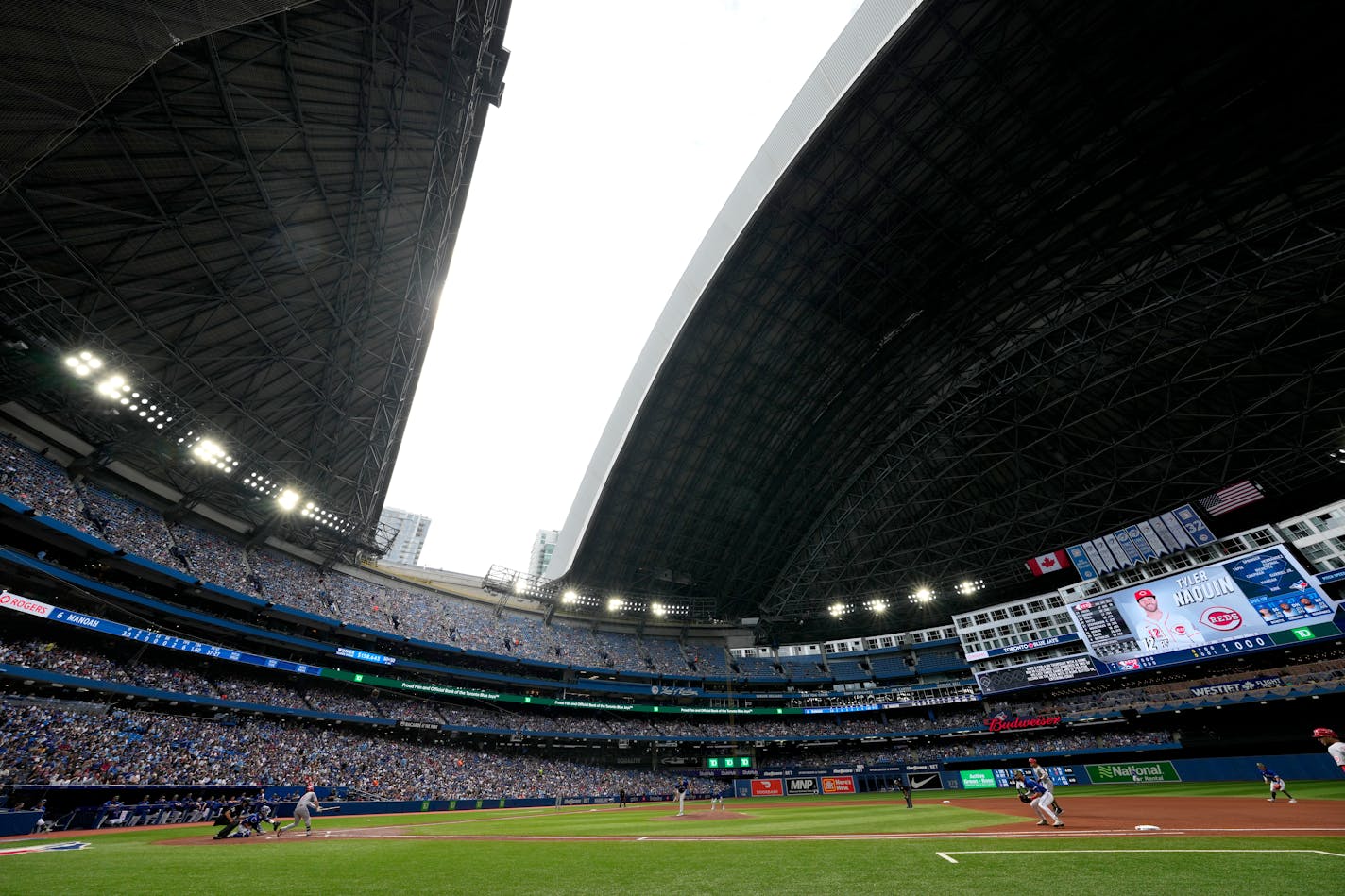 The roof is opened at the Rogers Centre following a storm that passed over the city during the fourth inning of a baseball game between the Toronto Blue Jays and the Cincinnati Reds in Toronto, Saturday, May 21, 2022. (Frank Gunn/The Canadian Press via AP)