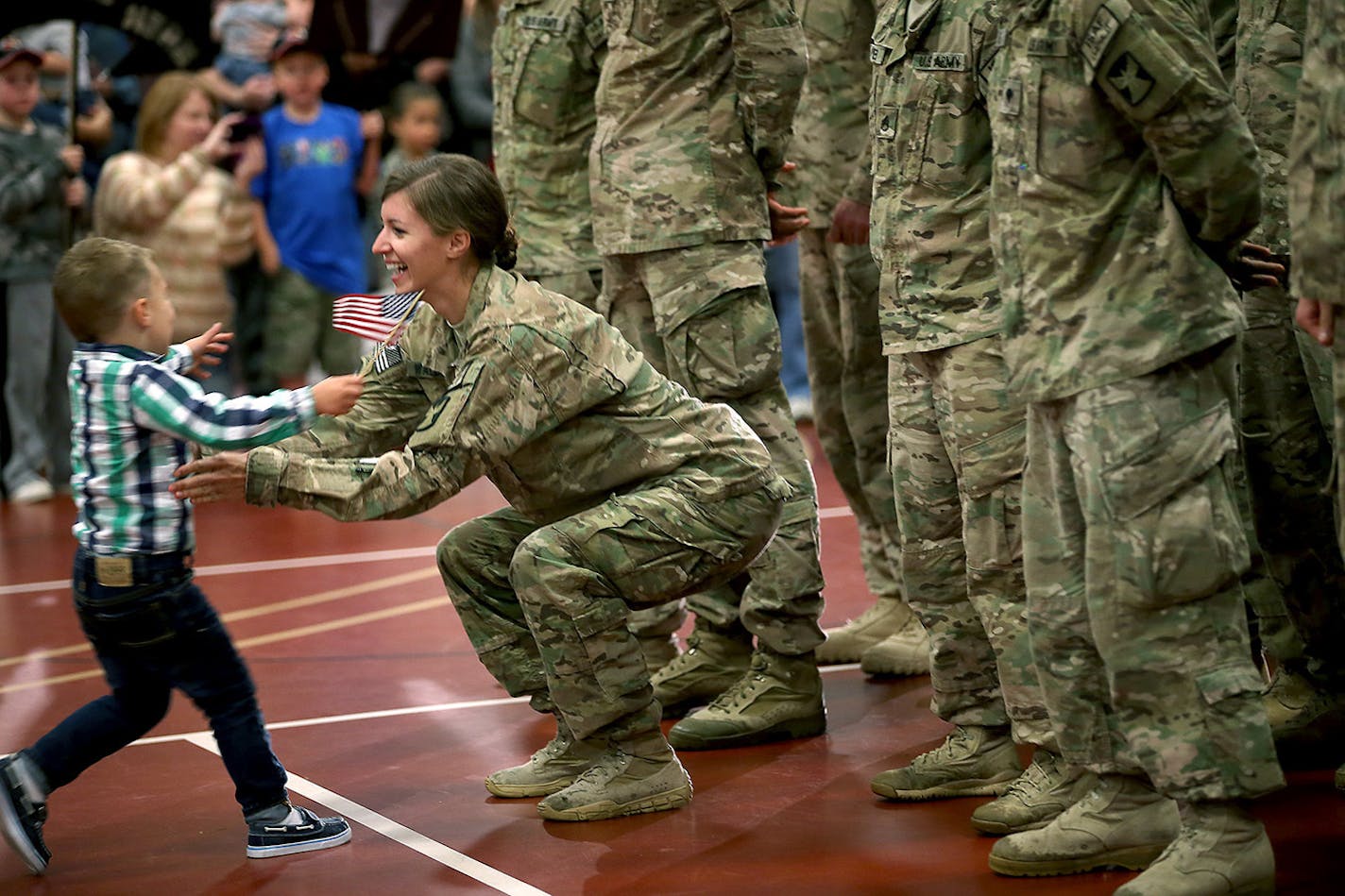 Cooper Waldvogel, 3, couldn't wait to hug his mother Kathryn Waldvogel after her return from Afghanistan at the Inver Grove Heights Training Center, Tuesday, September 16, 2014 in Inver Grove Heights, MN. More than 140 soldiers from the Minnesota National Guard's Chisholm-based 114th Transportation Company returned to Minnesota after a nine-month deployment to Afghanistan. ] (ELIZABETH FLORES/STAR TRIBUNE) ELIZABETH FLORES • eflores@startribune.com