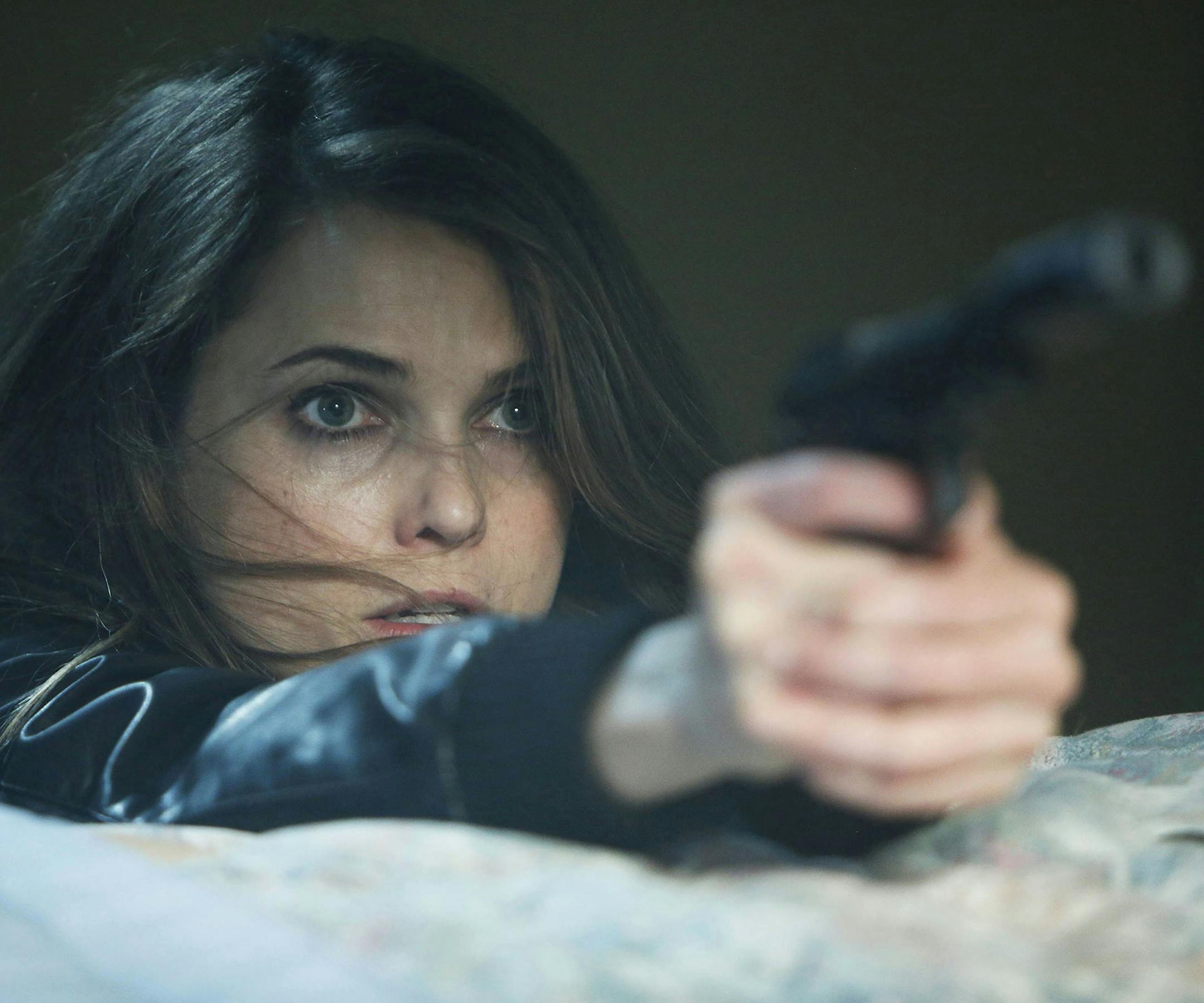 This TV publicity image released by FX shows Keri Russell as Elizabeth Jennings in a scene from the spy drama "The Americans." (AP Photo/FX, Craig Blankenhorn) ORG XMIT: NYET310