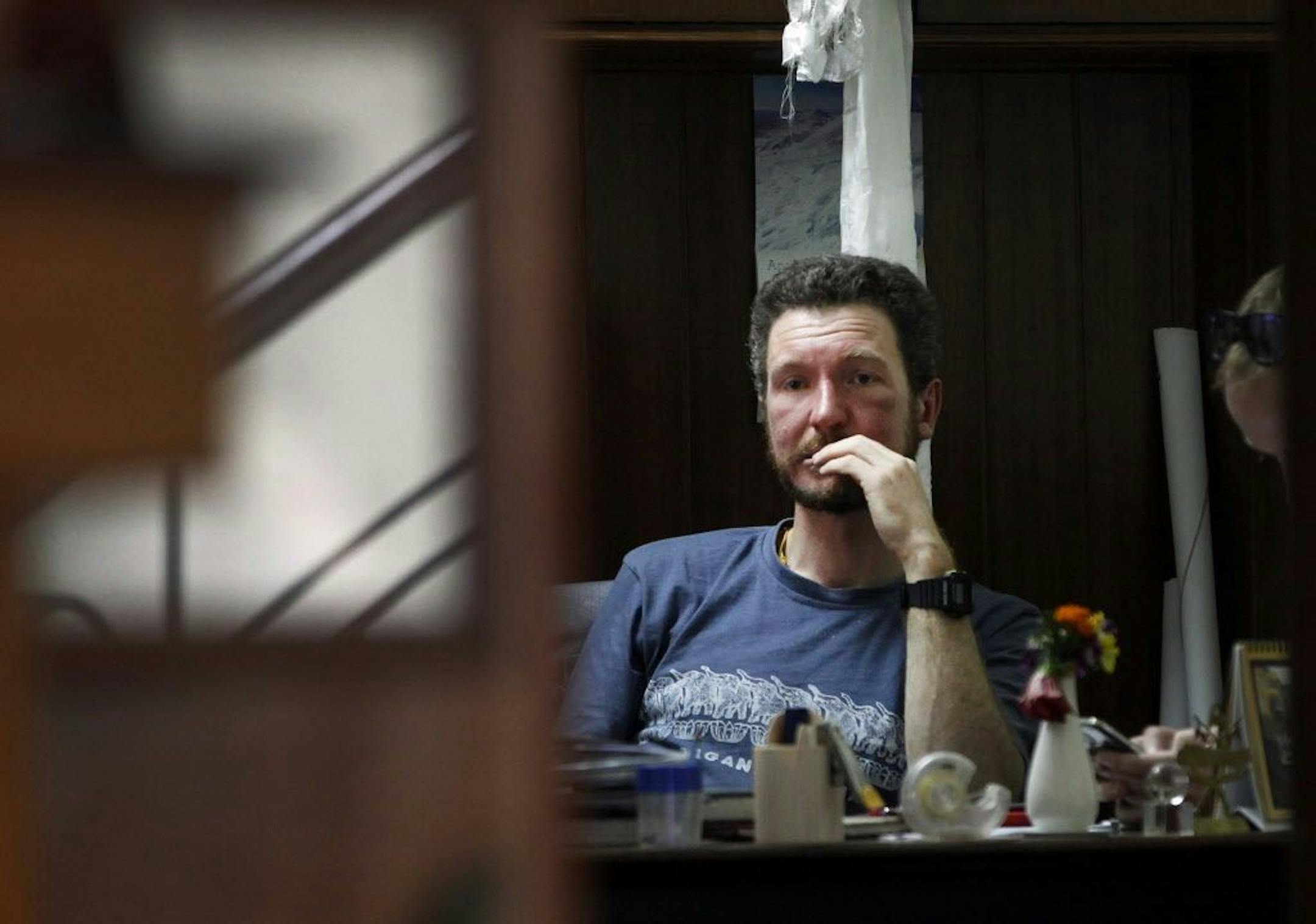 Australian Climber Robert Gropels who was rescued from Mount Everest sits in his hotel room in Kathmandu, Nepal, Tuesday, May 24, 2016. Robert's wife Maria Strydom, 34, died near the top suffering from altitude sickness. Everest climbers returning after successful ascent say mountaineers were pushing too hard and some not carrying enough oxygen that could have led to casualties and sicknesses over the weekend.
