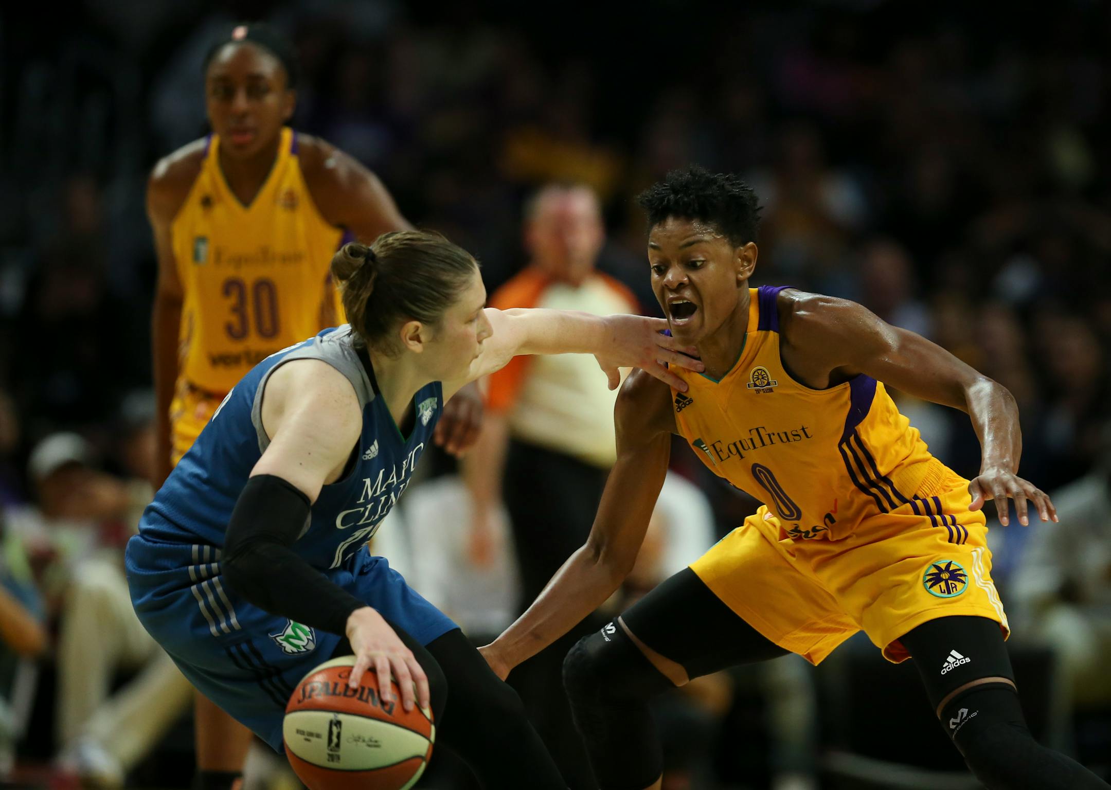 Minnesota Lynx guard Lindsay Whalen (13) drove the ball upcourt against Los Angeles Sparks guard Alana Beard (0) in the second half.