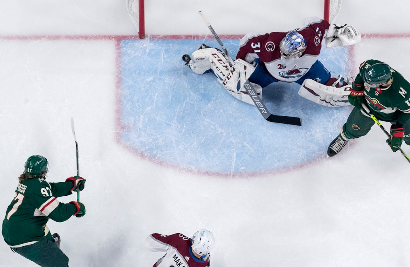 Kirill Kaprizov (97) of the Minnesota Wild shot the puck past the foot of Colorado Avalanche goalie Philipp Grubauer on Wednesday.