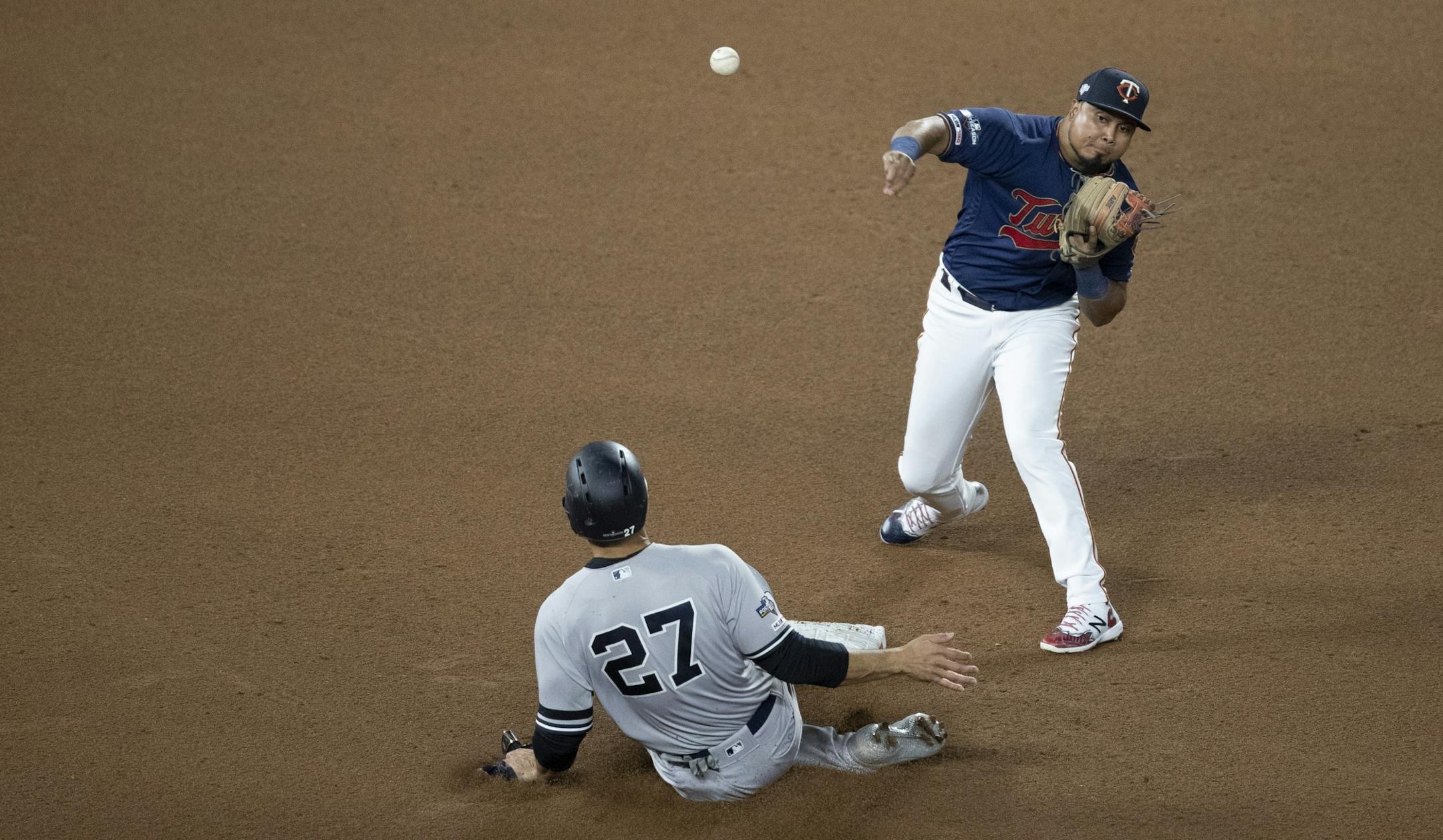 Minnesota Twins second baseman Luis Arraez (2) threw out New York Yankees left fielder Giancarlo Stanton (27) on a double play in the 4th inning during the third game of the ALDS playoffs at Target Field .