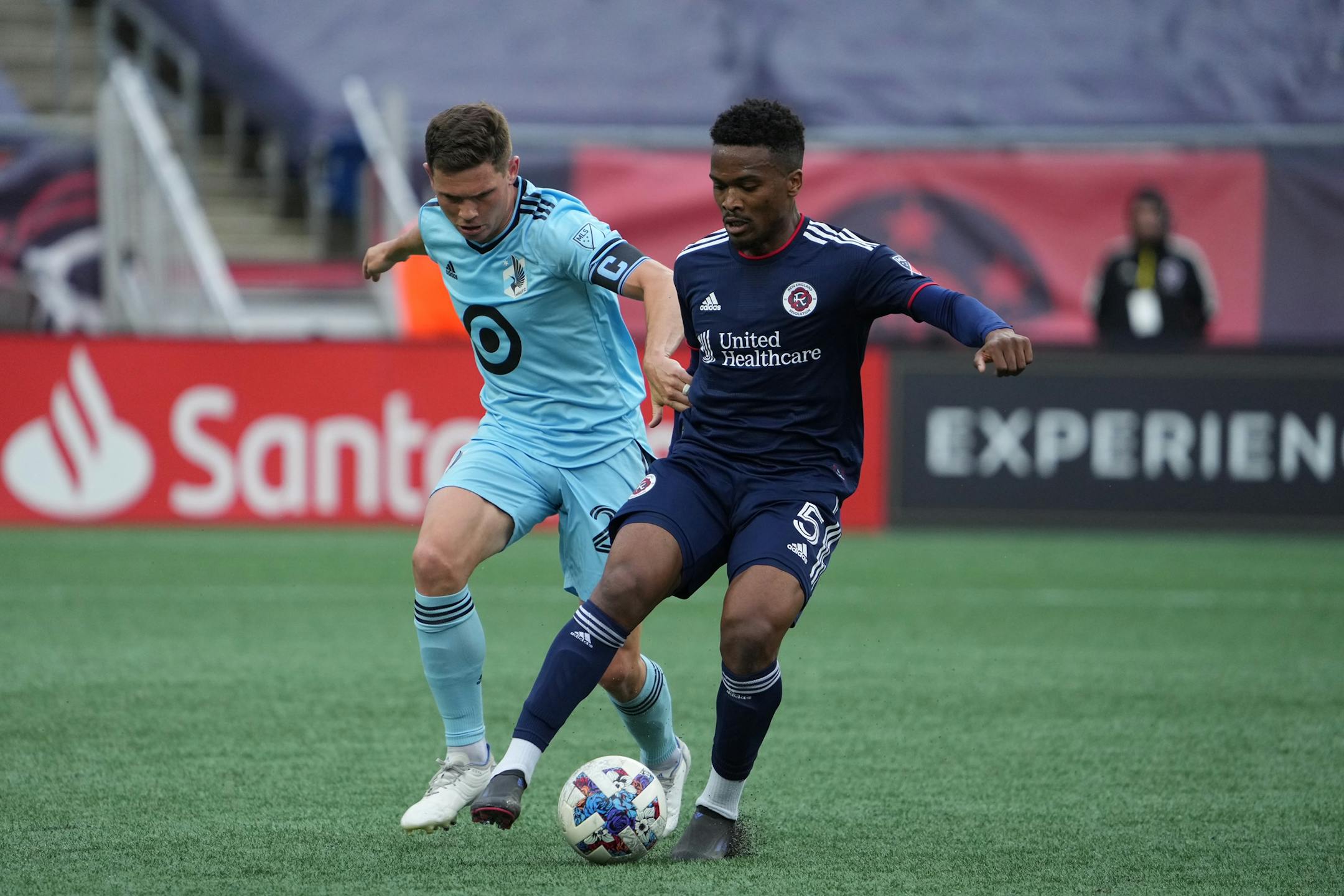 Minnesota United's Wil Trapp (20) went against New England Revoluton's Wilfrid Kaptoum (5) during Sunday's MLS game in Foxborough, Mass., on June 19, 2022. (David Silverman/New England Revolution)