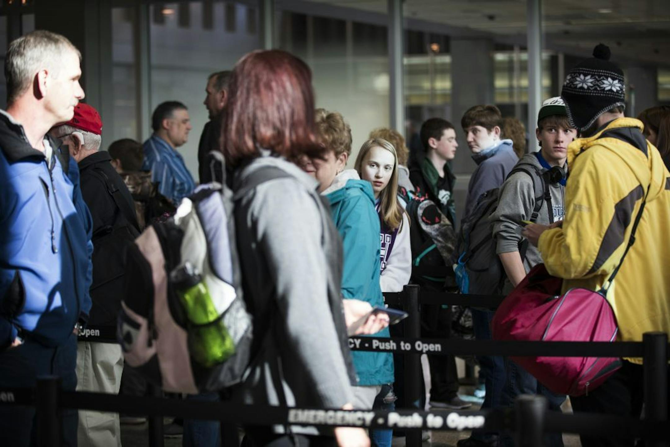 Passengers wait in line to go through the new north security checkpoint at Terminal 1 of Minneapolis-St. Paul International Airport on March 6.