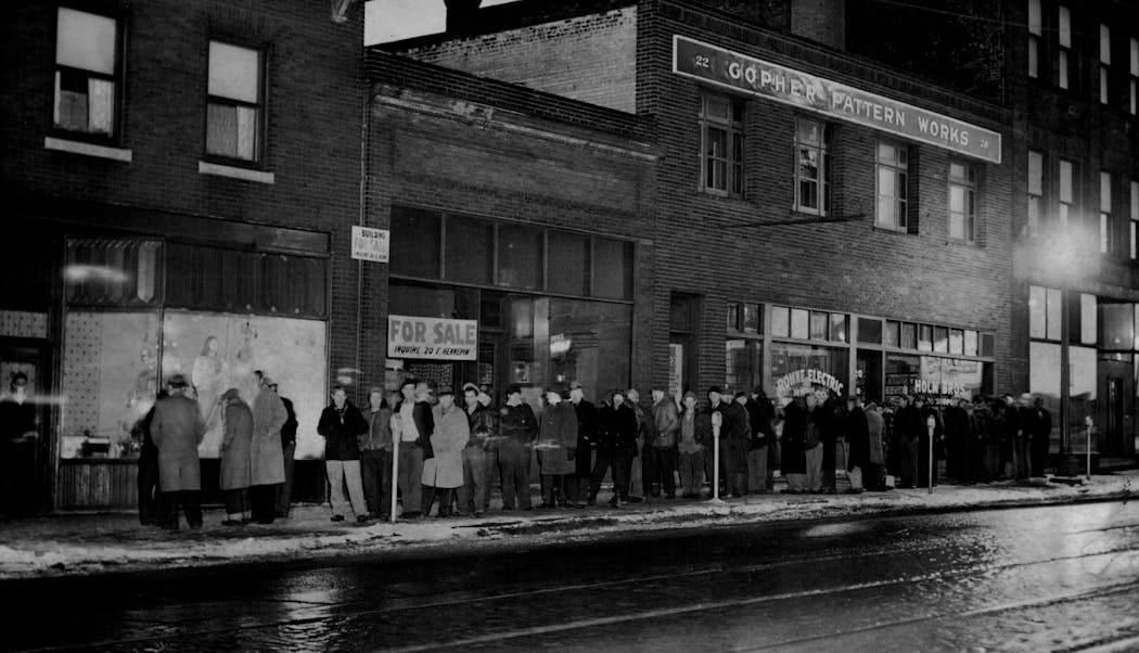 Skid Row residents waited in the cold for a meal at House of Charity, Inc. in 1953.