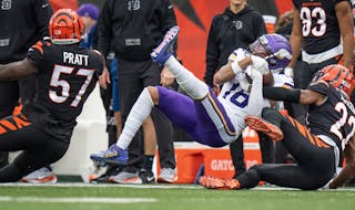 Vikings receiver Justin Jefferson pulled down a third-quarter first down catch over Bengals safety Jordan Battle on Saturday