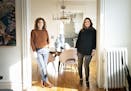Pamela Diamond and her daughter Kathryn Rozin in the entrance to Rozin's dining room. The two women and their families share a Minneapolis duplex.