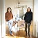 Pamela Diamond and her daughter Kathryn Rozin in the entrance to Rozin's dining room. The two women and their families share a Minneapolis duplex.