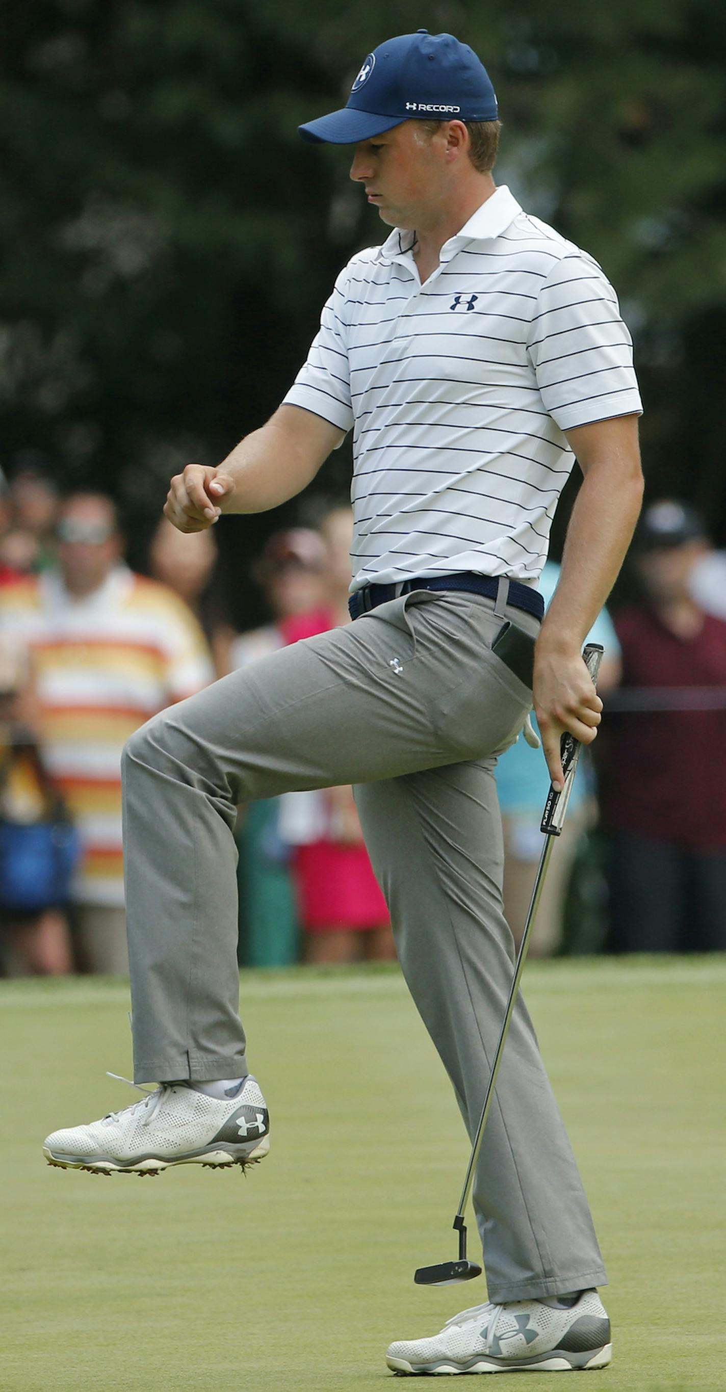 Jordan Spieth reacts to missing a putt on the first hole during the third round of the PGA Championship golf tournament at Baltusrol Golf Club in Springfield, N.J., Saturday, July 30, 2016. (AP Photo/Mike Groll)