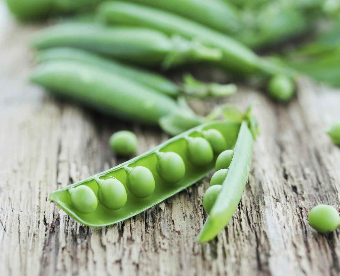 fresh pods of green peas, from istock