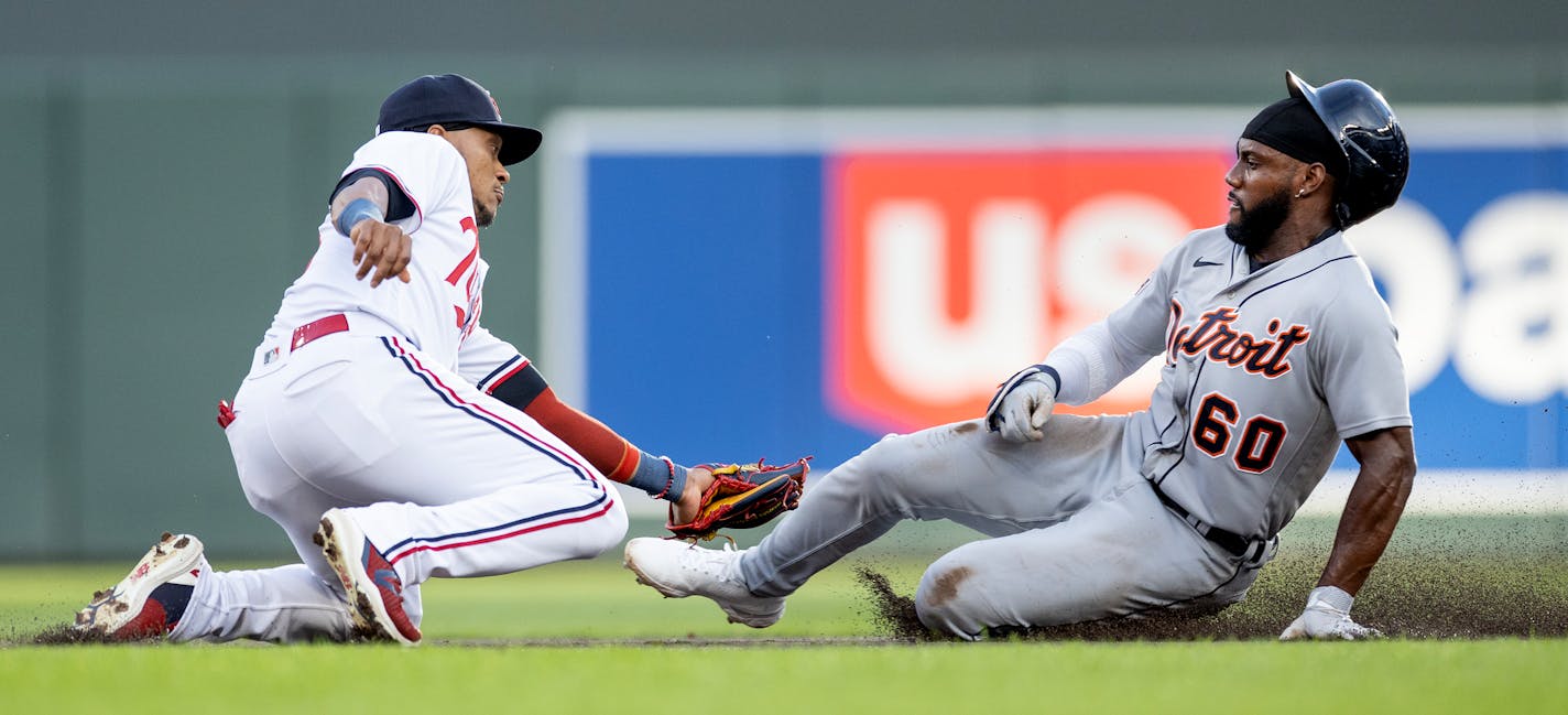 Jorge Polanco (11) of the Minnesota Twins tags out Akil Baddoo (60) of the Detroit Tigers in the first inning Tuesday, August 15, 2023, Target Field in Minneapolis, Minn. ] CARLOS GONZALEZ • carlos.gonzalez@startribune.com