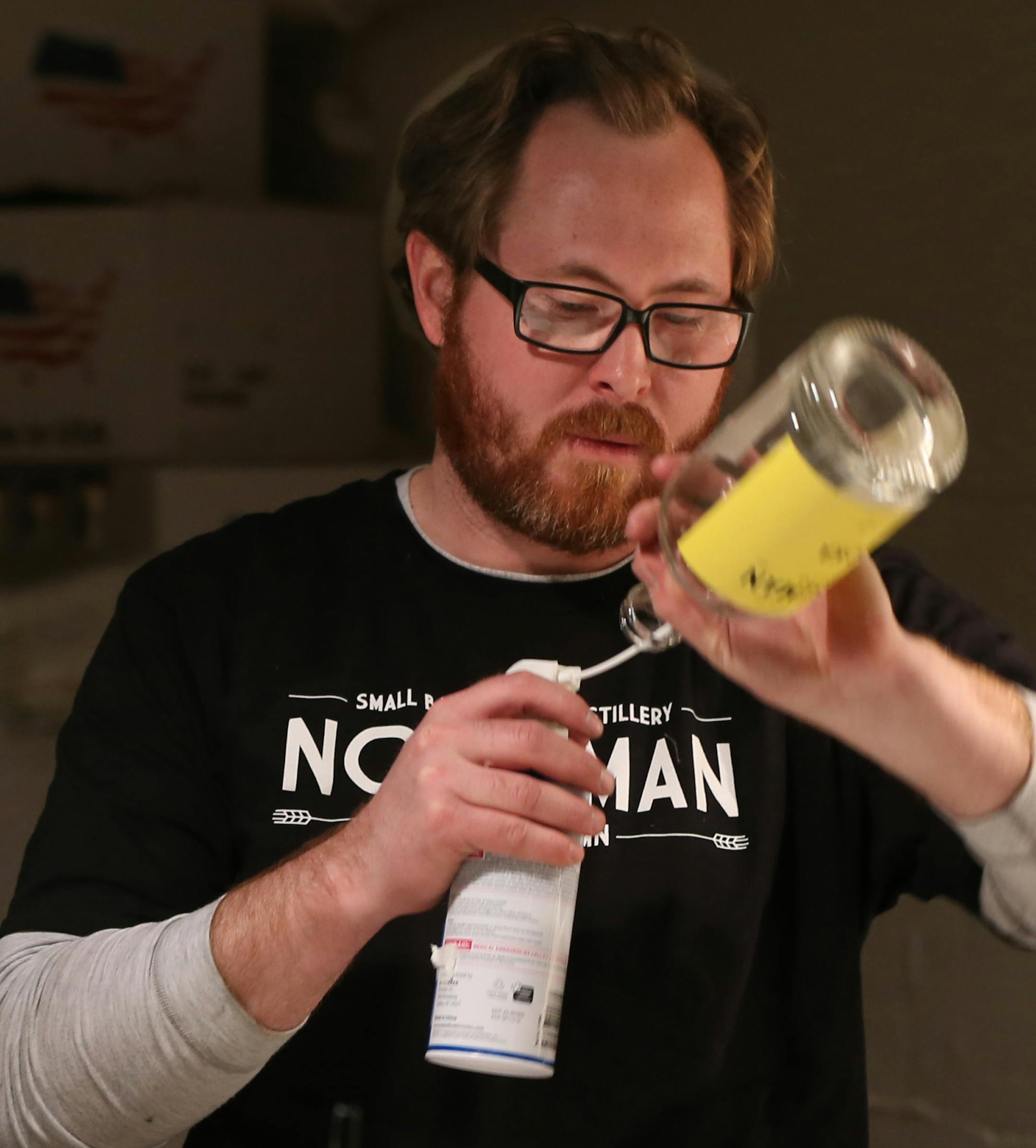Scott Ervin cleaned bottles before filling with Norseman Vodka on 1/10/14. The year starts off with a high-proof bang, as micro-distillers open in the metro. One of the first to actually have product in stores and bars is the small Norseman Distillery in NE Mpls., run by Scott Ervin.] Bruce Bisping/Star Tribune bbisping@startribune.com Scott Ervin/source. ORG XMIT: MIN1401101403390655