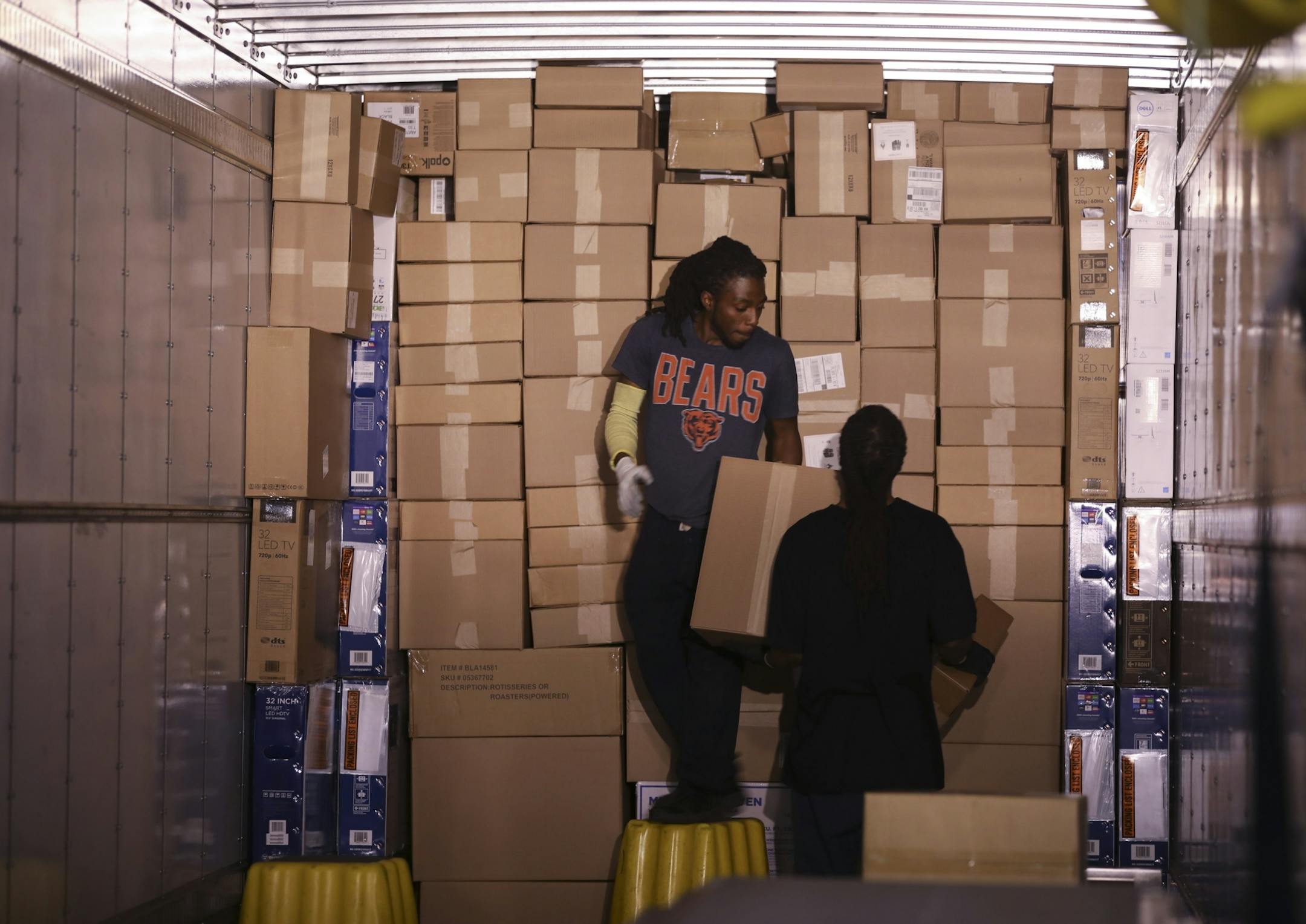 Workers at the Best Buy distribution center in Bloomington packed a semi-trailer of outgoing orders Monday afternoon.