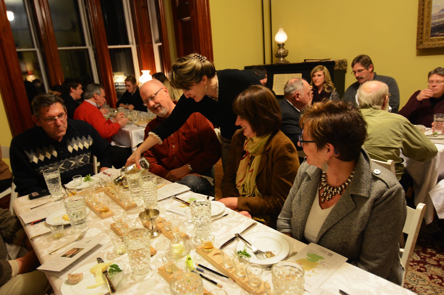 Amy Deaver, the new site manager at the LeDuc historic estate, poured scotch at a recent tasting. Photo by Liz Rolfsmeier, Special to the Star Tribune