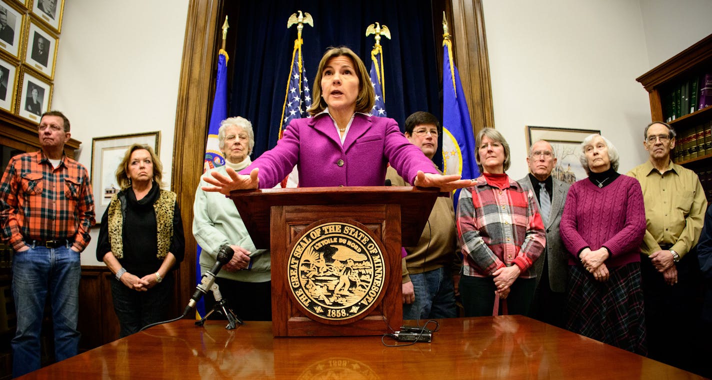 Surrounded by victims of a "trust mill" scam, Attorney General Lori Swanson announced a lawsuit against Heritage Partners LLC, a Minnesota company that used high pressure tactics to sell over priced living trusts and wills, prepared by an Arizona man who falsley claimed to be an attorney. Monday, February 3, 2014 ] GLEN STUBBE * gstubbe@startribune.com