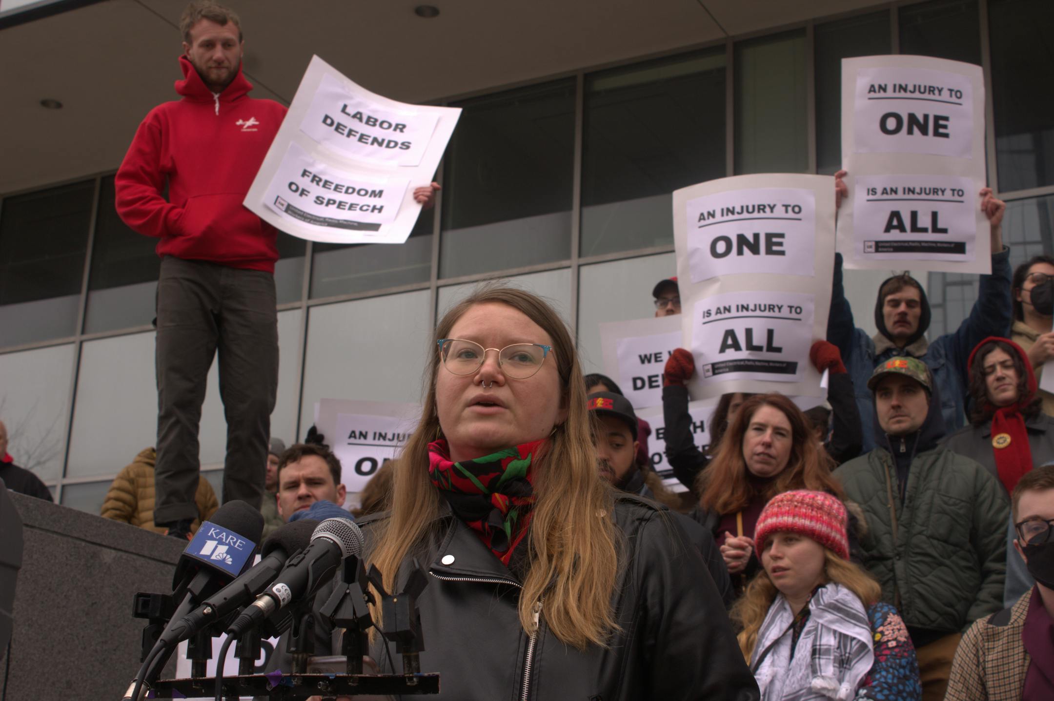 Local 1105 President Abaki Beck speaks to fellow graduate students and protesters after a student was detained by ICE.