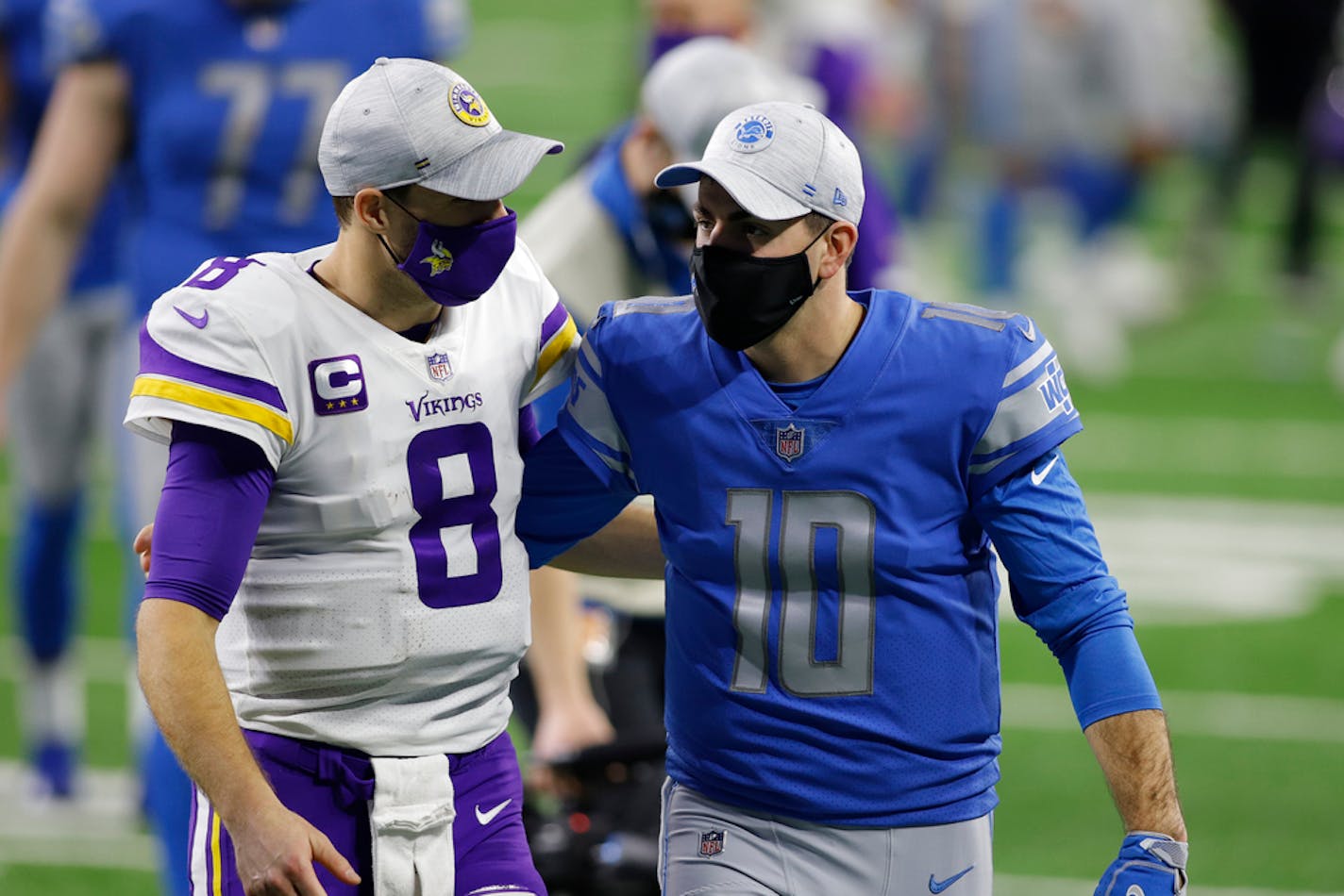 Minnesota Vikings quarterback Kirk Cousins (8) and Detroit Lions quarterback David Blough (10) walk off the field after their NFL football game, Sunday, Jan. 3, 2021, in Detroit. (AP Photo/Al Goldis)