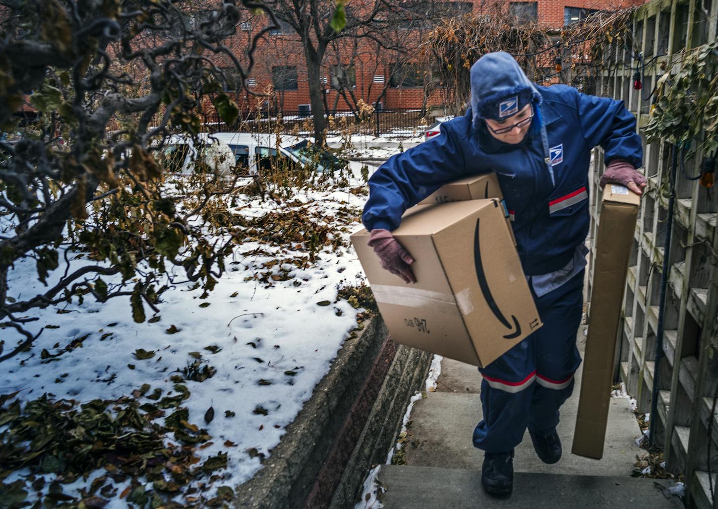 Missie Kittok, who has been a letter carrier for 15 months helps deliver some packages in time for Christmas. "Packages are easier in some ways," says Kittok who spends more time driving than walking in that respect. ]The United States Postal Service will deliver packages to Minneapolis customers on Sunday, Dec. 24. USPS doesn't normally deliver on Sundays, but is doing so in this case because it's Christmas Eve.Richard Tsong-Taatarii&#xef;rtsong-taatarii@startribune.com