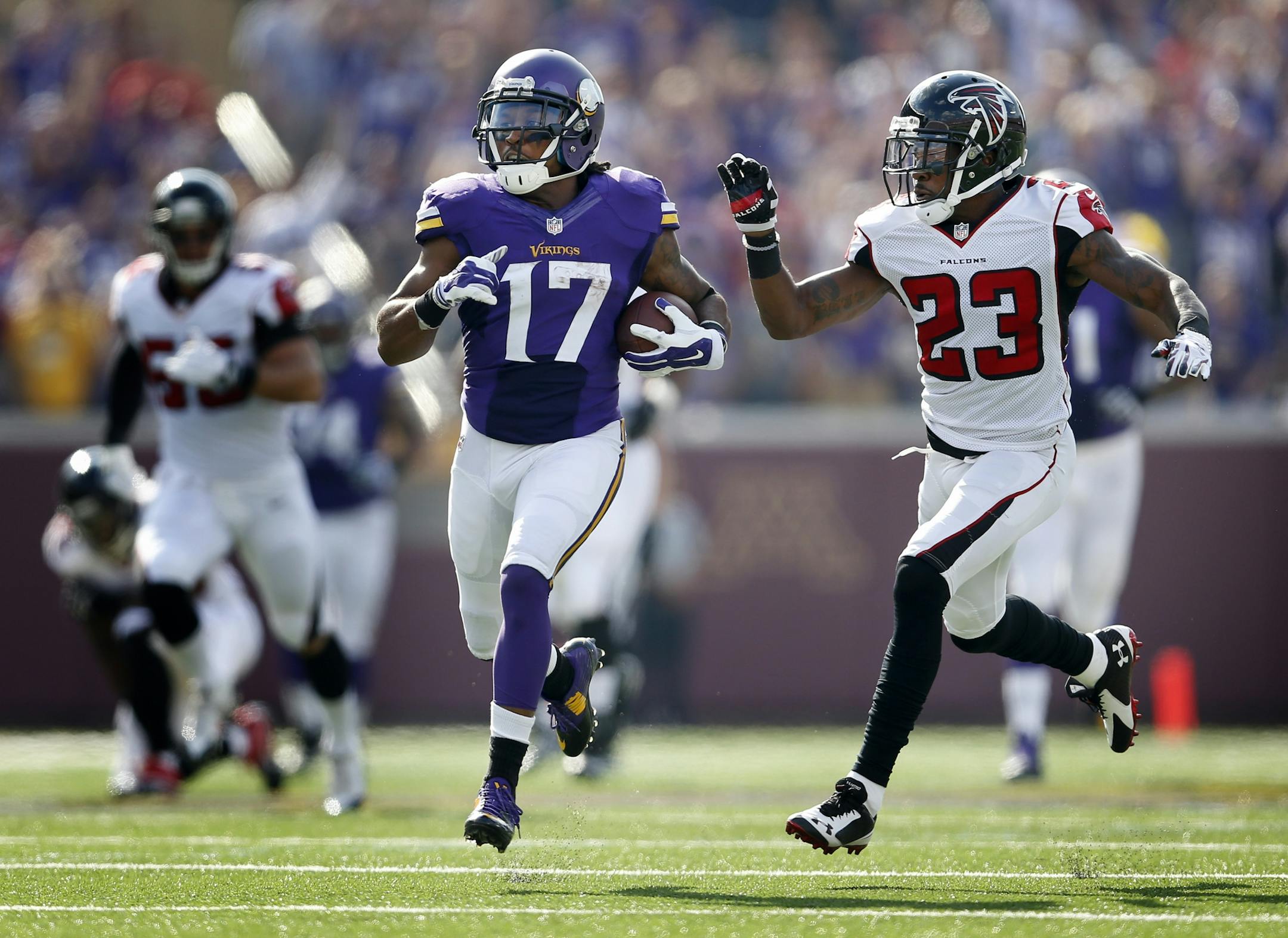 Minnesota Vikings Jarius Wright (17) was chased down by Robert Alford (23) during a 52-yard catch and run in the first quarter.