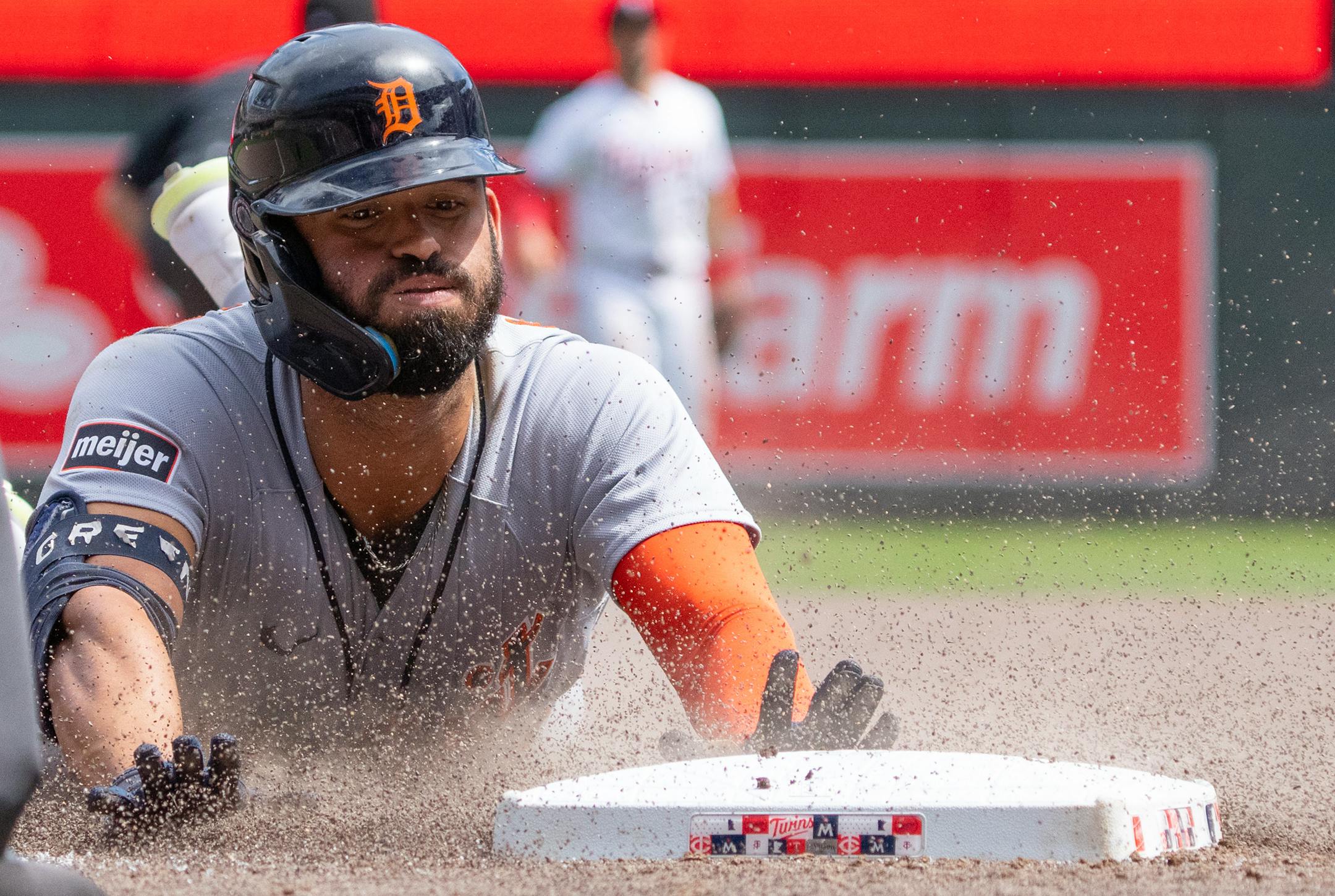 Detroit Tigers center fielder Riley Greene (31) slides into third base after hitting a triple against the Minnesota Twins in the seventh inning.