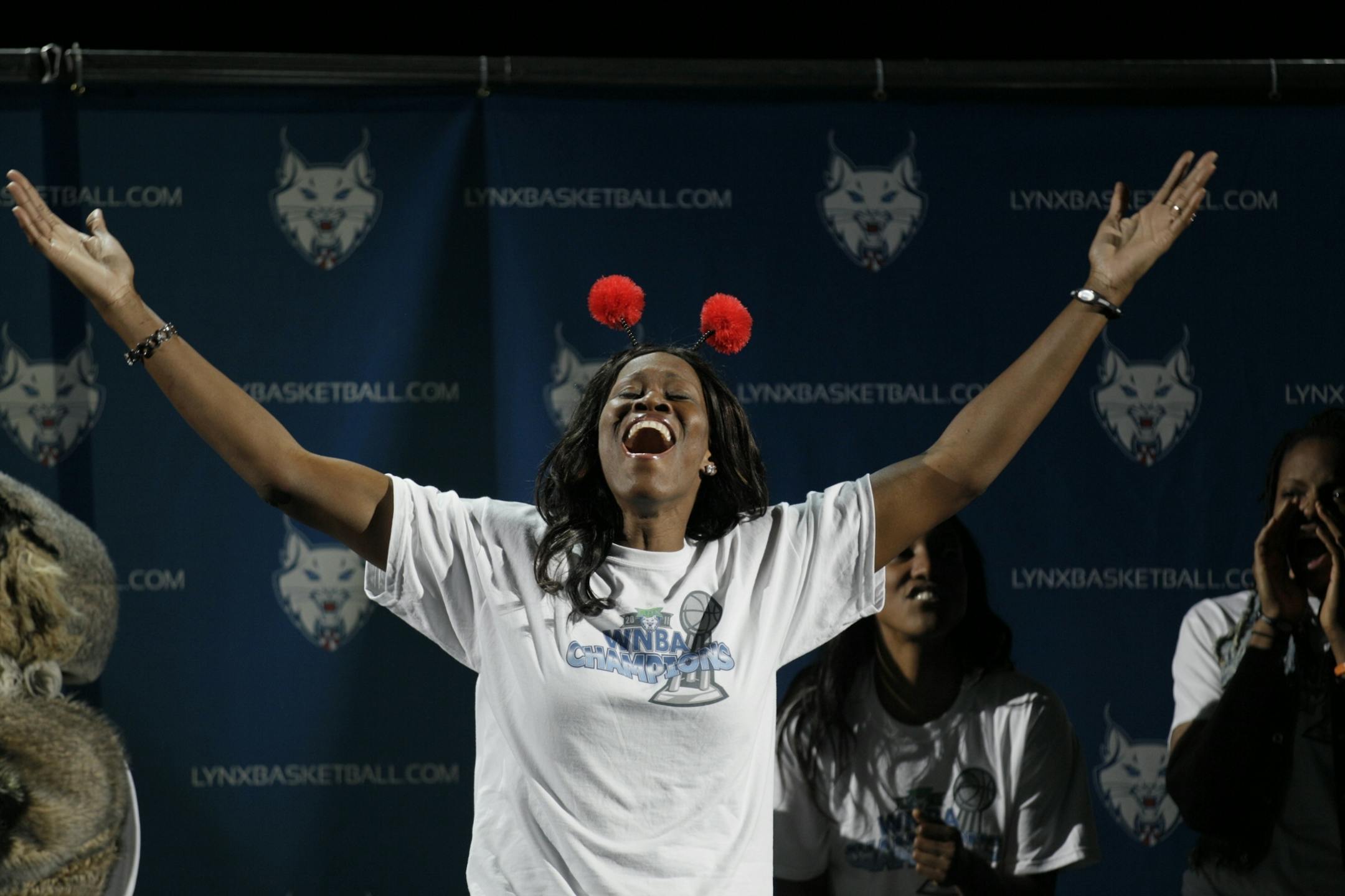 Minnesota Lynx player Taj McWilliams-Franklin celebrates with the rest of the team and fans at Target Center Tuesday afternoon following the teams WBA championship.