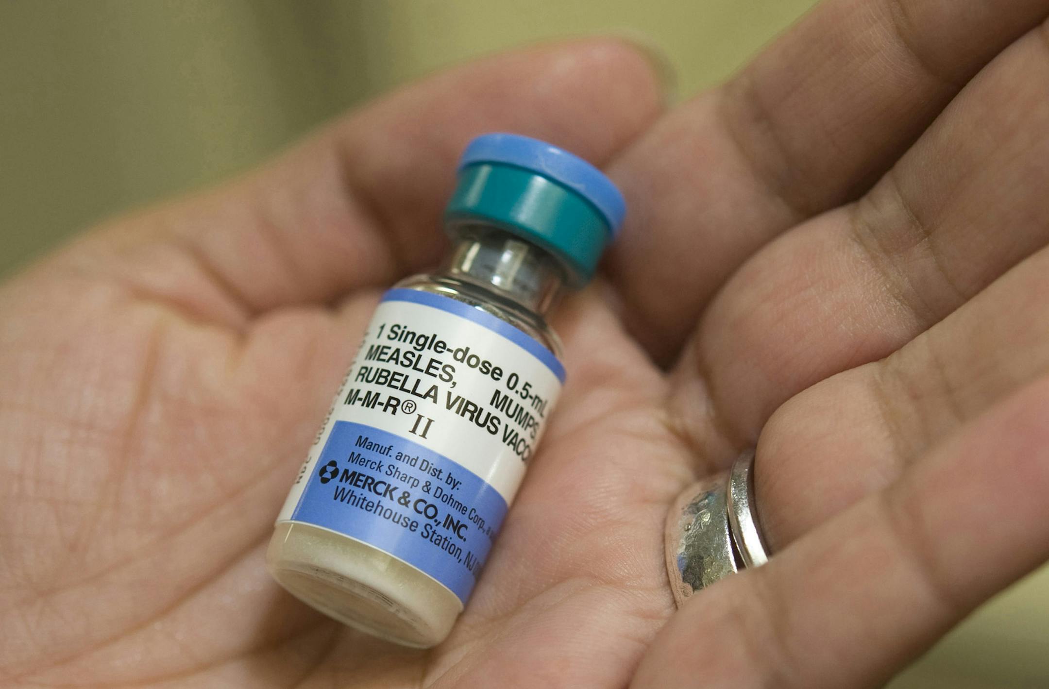 Dr. Shruti K. Gohil, associate medical director for epidemiology and infection prevention at UCI Medical Center, holds a dose of MMR, the vaccine against measles, mumps and rubella. (Ana Venegas/Orange County Register/TNS) ORG XMIT: 1163174 ORG XMIT: MIN1501282305177647 ORG XMIT: MIN1502031200399233