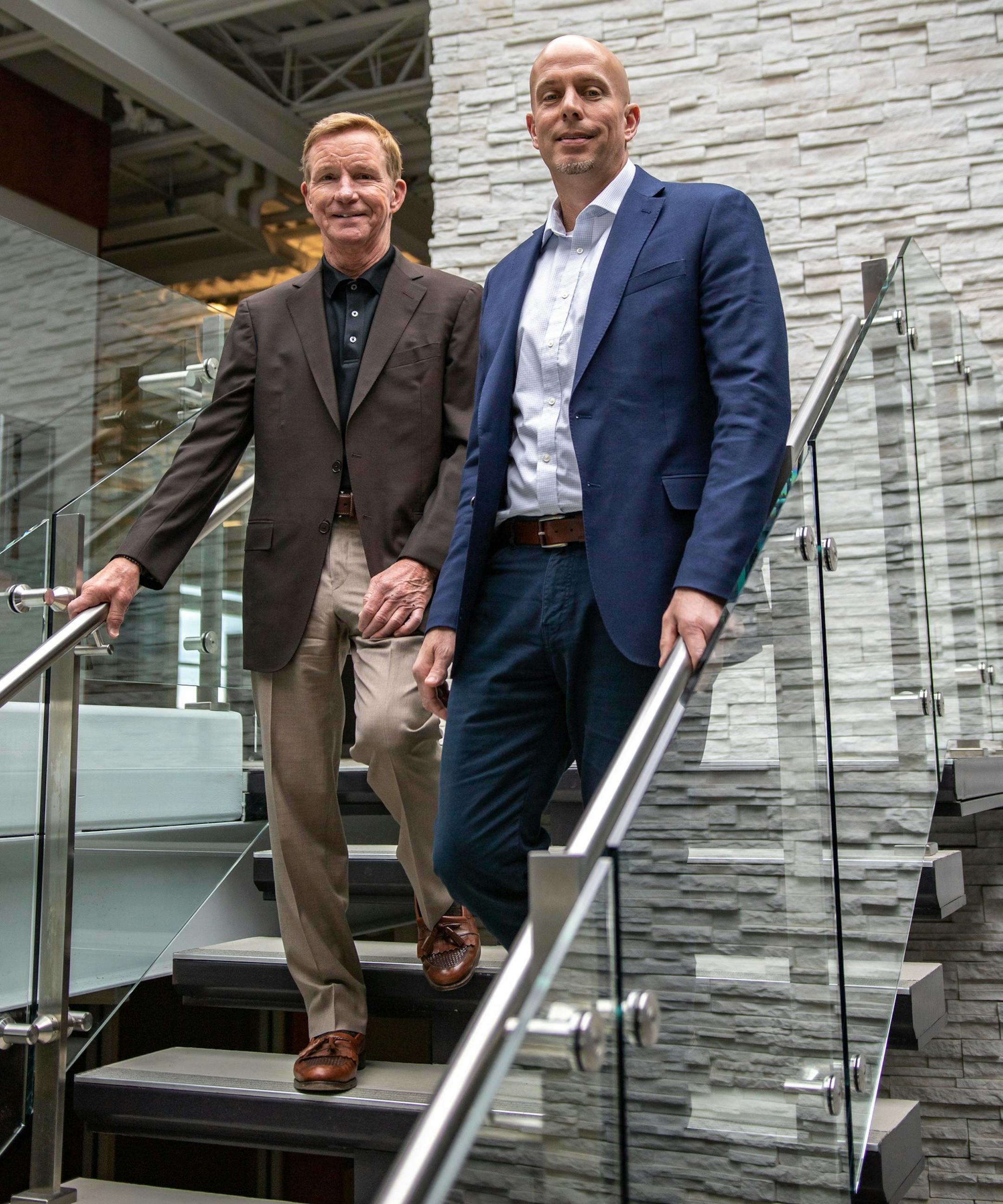 Knutson Construction owner Steve Curry, left, and president James Benning.