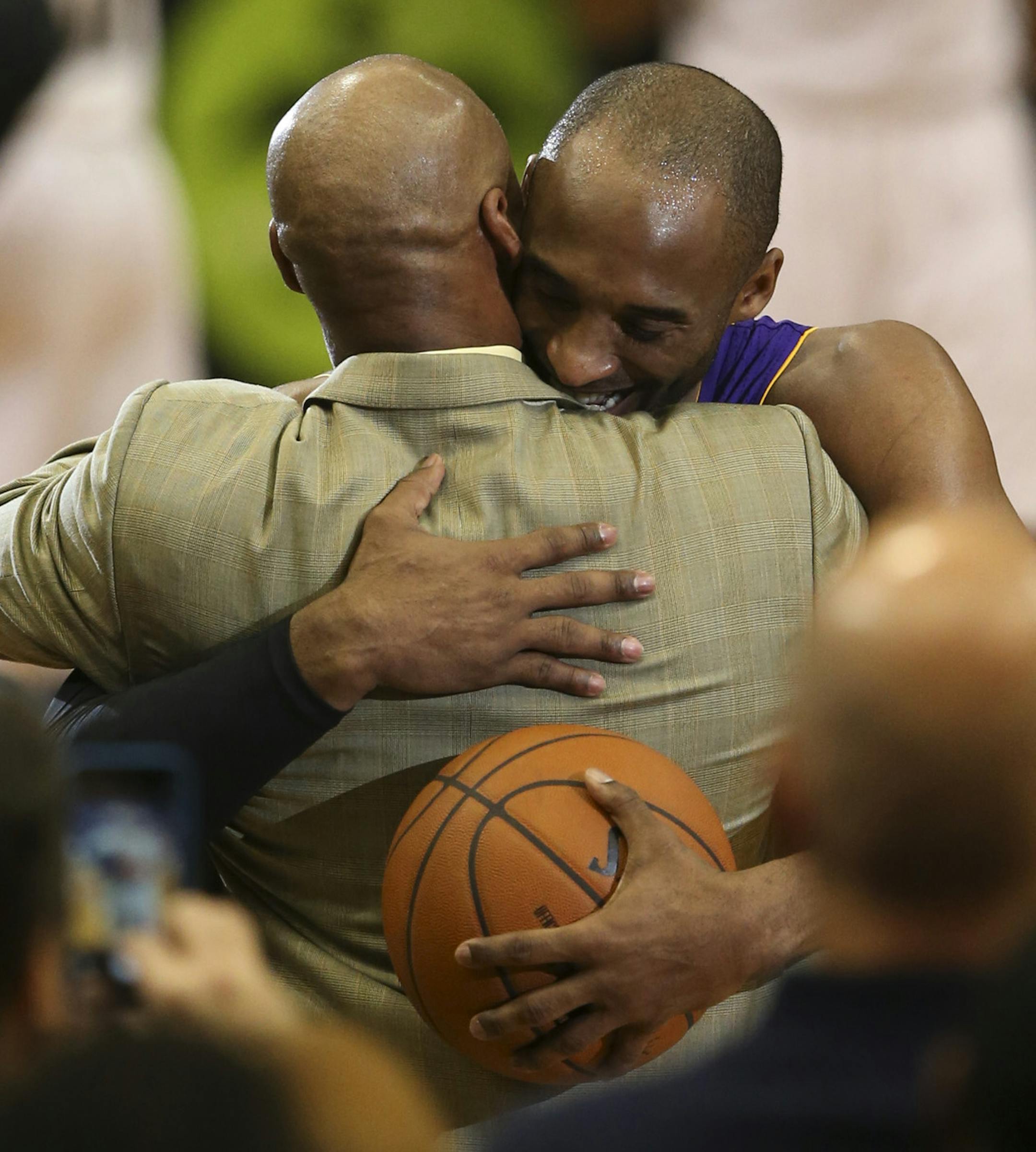 The Lakers' Kobe Bryant embraced Los Angeles head coach Byron Scott after he moved past Michael Jordan on the all time scoring list in the second quarter Sunday night at Target Center in Minneapolis. ] JEFF WHEELER ‚Ä¢ jeff.wheeler@startribune.com The Minnesota Timberwolves hosted the Los Angeles Lakers in an NBA game Sunday night, December 14, 2014 at Target Center in Minneapolis. The Lakers' Kobe Bryant surpassed Michael Jordan on the all-time scoring list in the second quarte