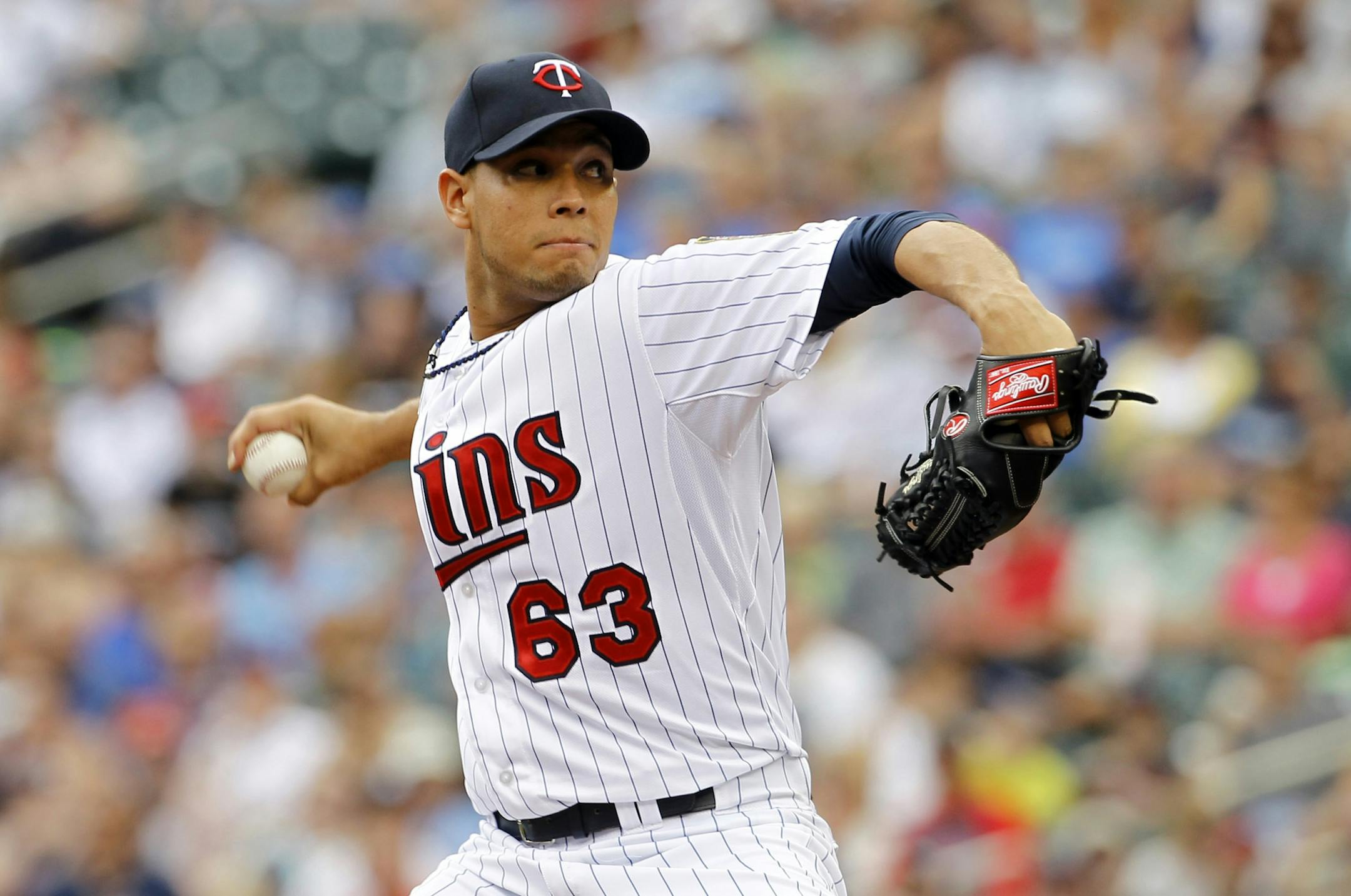 Minnesota Twins starting pitcher Yohan Pino delivers to the Chicago White Sox during the first inning of a baseball game in Minneapolis, Sunday, July 27, 2014.