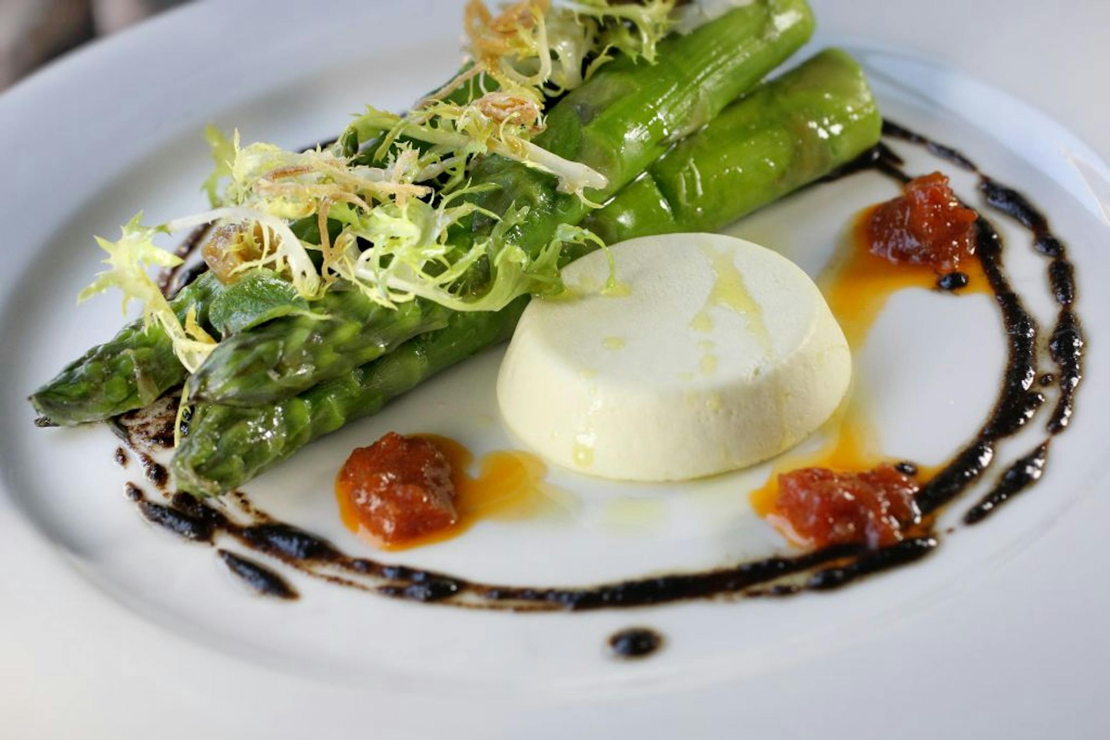 Green asparagus with feta flan is on Saffron's spring menu.