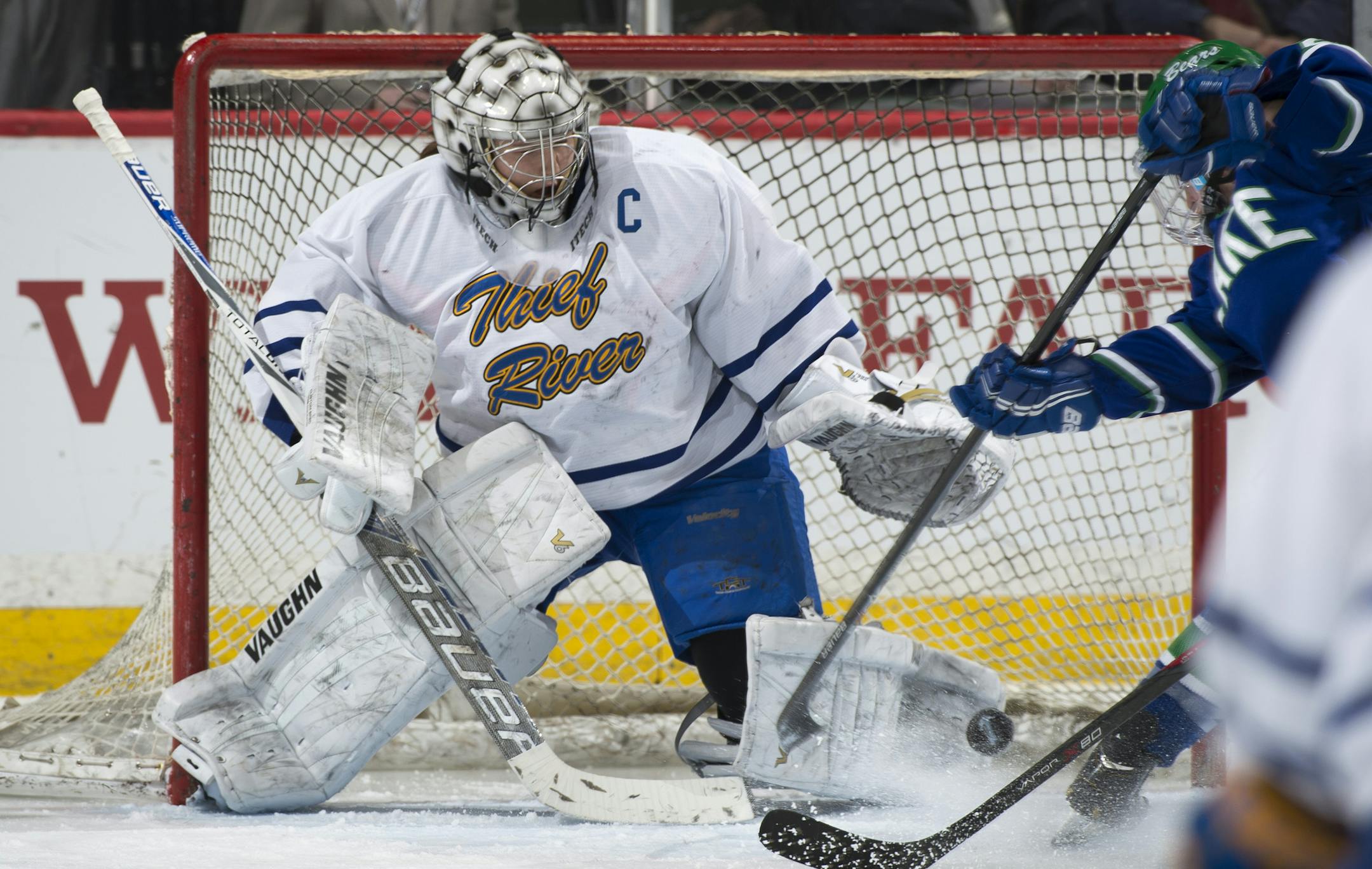 Thief River Falls goalie Frances Marshall (30) eyes the puck on a scoring attempts by Blake in the second period. ] (Aaron Lavinsky | StarTribune) The Blake School plays Thief River Falls in the 1A Girls' Hockey Championship game on Saturday, Feb. 21, 2015 at Xcel Energy Center in St. Paul.