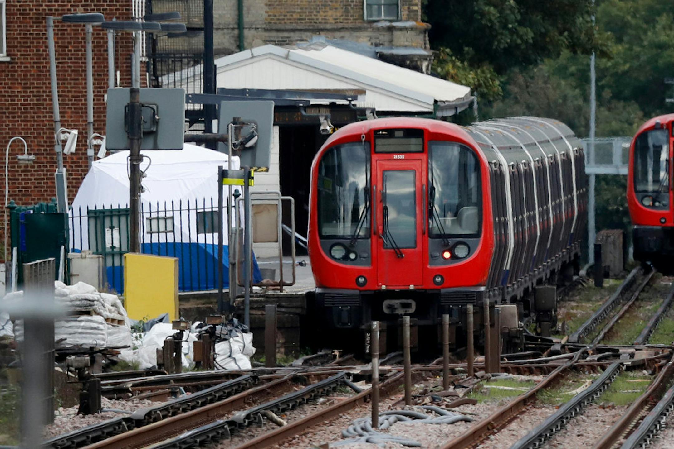 A police forensic tent stands on the platform next to the train on which a homemade bomb exploded at Parsons Green subway station in London on Friday.