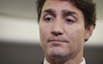 Canadian Prime Minister and Liberal Party leader Justin Trudeau reacts as he makes a statement in regards to a photo coming to light of himself from 2