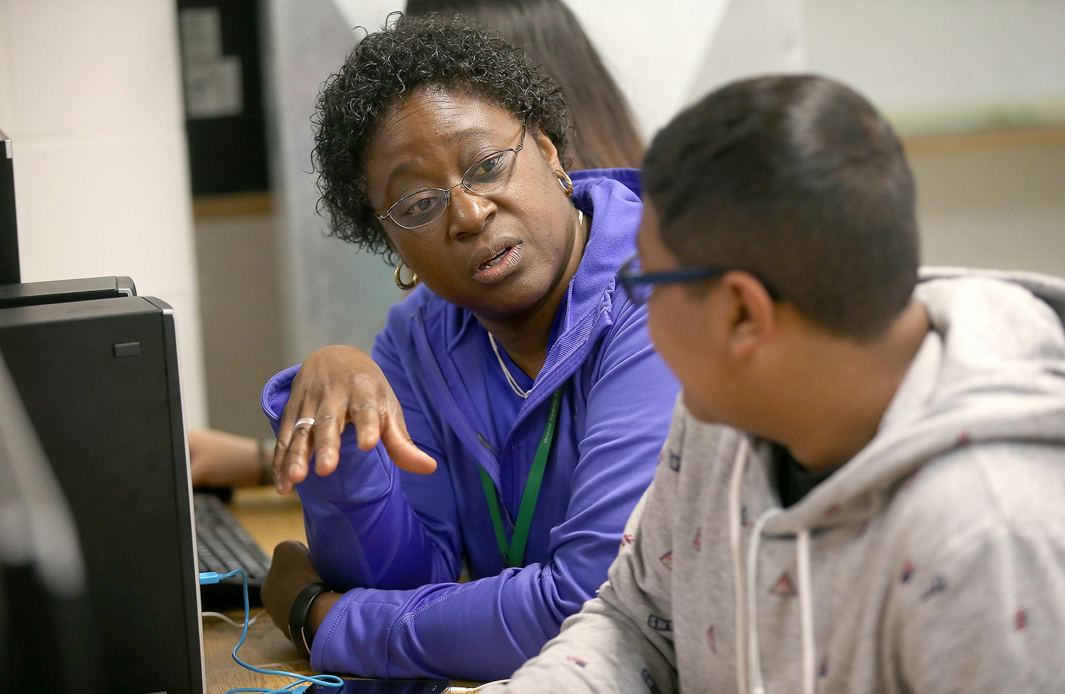 Chris Hester, current principal at Cooper High School, visited with students during a computer lab class, Friday, May 22, 2015. Hester will be the new principal of the FAIR school in Robbinsdale next year. ] (ELIZABETH FLORES/STAR TRIBUNE) ELIZABETH FLORES &#x2022; eflores@startribune.com