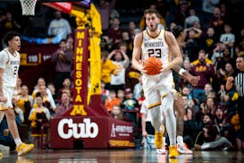 Minnesota forward Parker Fox (23) is shocked after a turnover right after the Gophers regained the lead in the second half of the basketball game agai