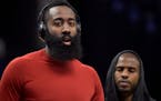 In this Nov. 18, 2017 photo, Houston Rockets guards James Harden, left, and Chris Paul warm up before and NBA basketball game against the Memphis Griz