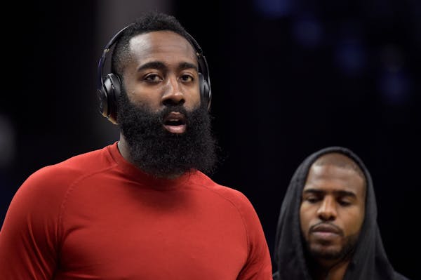 In this Nov. 18, 2017 photo, Houston Rockets guards James Harden, left, and Chris Paul warm up before and NBA basketball game against the Memphis Griz