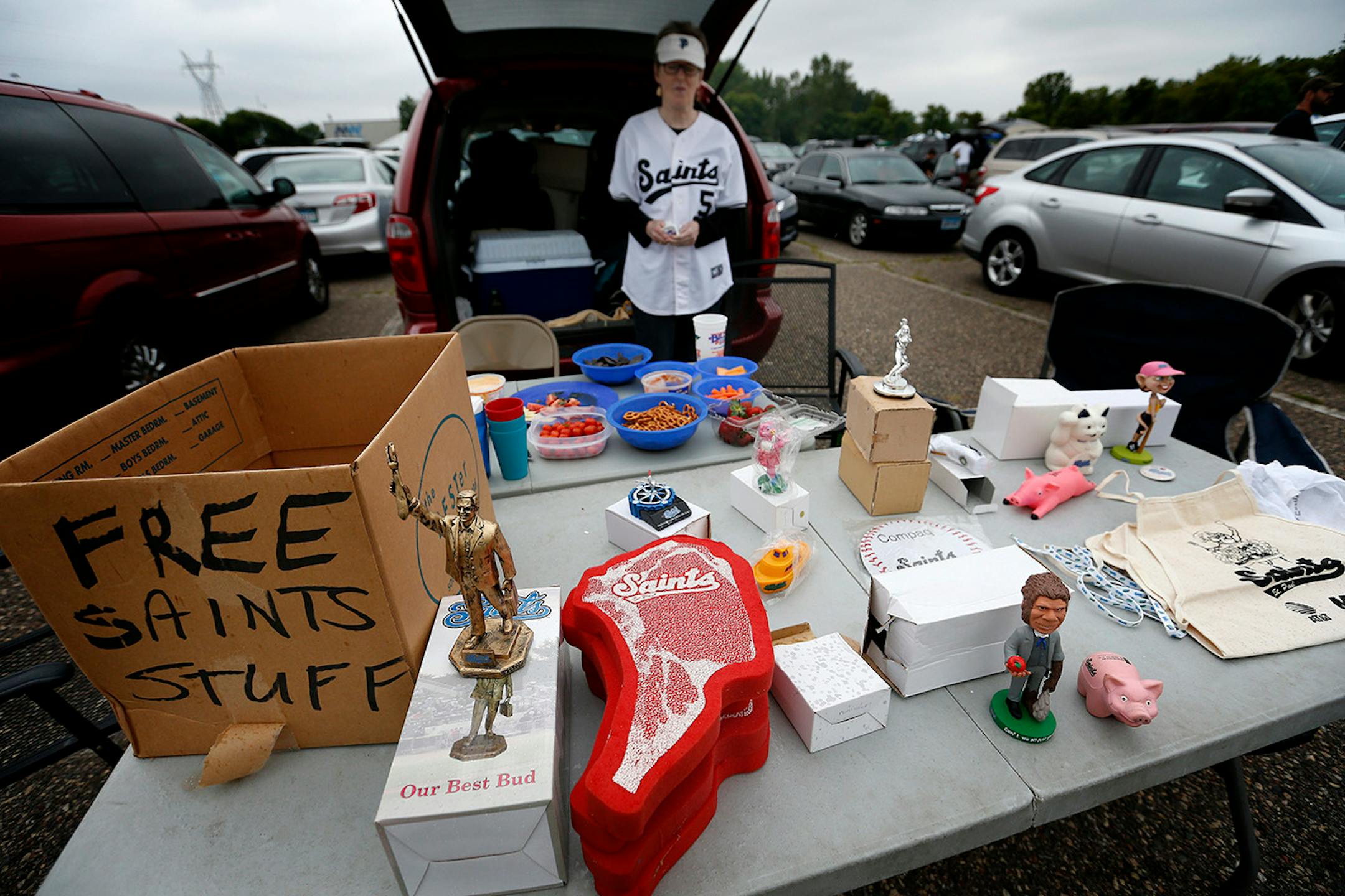Nancy Peterson was giving away St. Paul Saints memorabilia she and her husband had collected over the years before the St. Paul Saints final game at Midway Stadium on Thursday night. ] CARLOS GONZALEZ cgonzalez@startribune.com - August 28, 2014, St. Paul, Minn., Midway Stadium, St. Paul Saints baseball vs. Winnipeg - Final Saints game at Midway Stadium