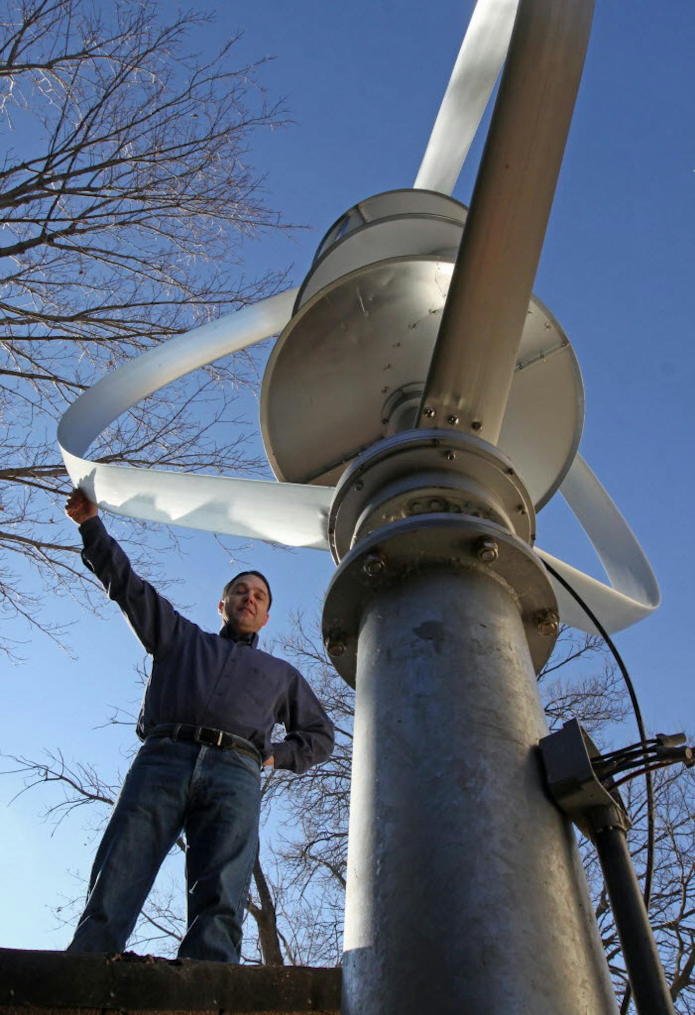 Jay Nygard has erected a wind turbine that resembles a huge egg beater at the rear of his house on Lake Minnetonka in Orono. His effort to go green has landed hime in a court battle with the city of Orono over construction of the wind turbine. He was photographed on 11/17/11.] Bruce Bisping/Star Tribune. May Nygard/source.