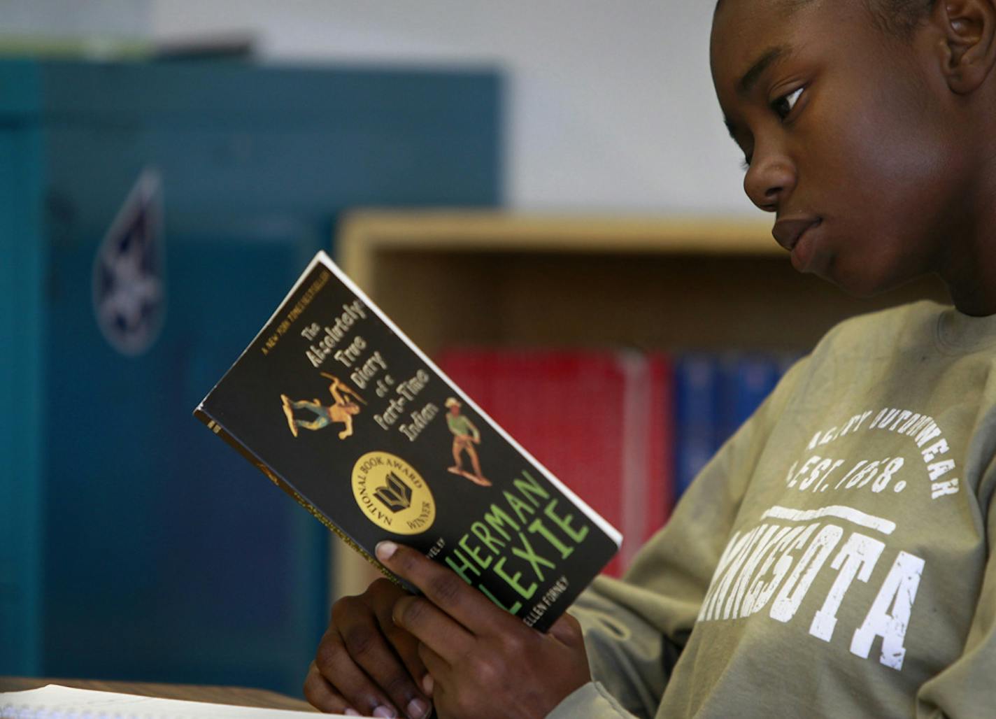 Mercedes Thomas, 14, read her book assignment during English class at the new Academy of Arts and Communications program at North High School. The school attracted 65 freshmen this year.