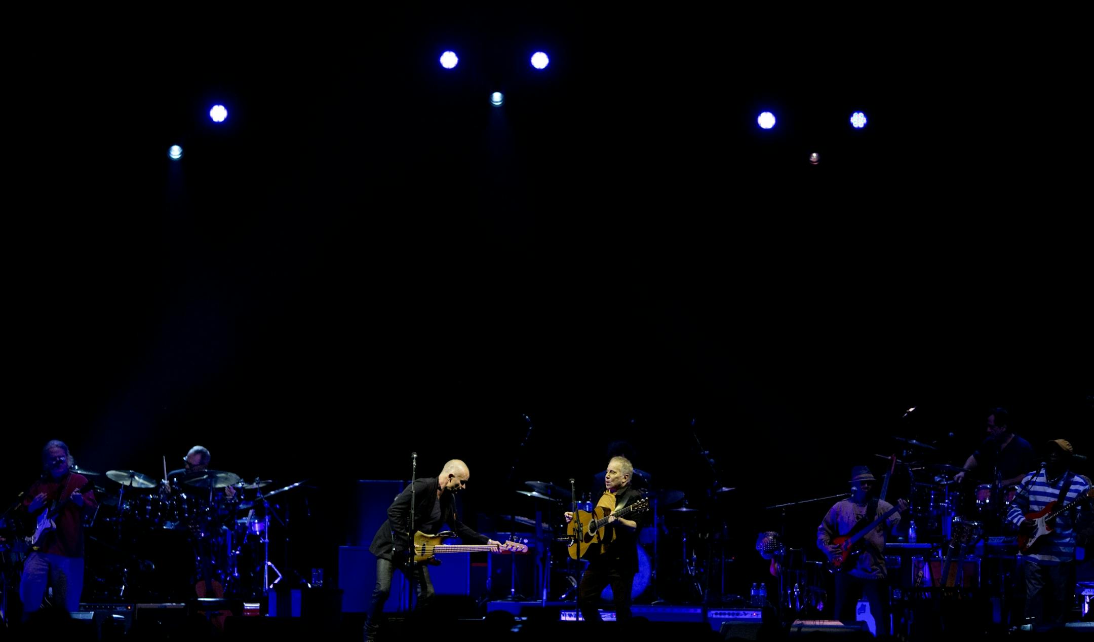 Longtime New York neighbors Sting and Paul Simon decided to hit the road and tour together. The Paul Simon & Sting: On Stage Together tour stopped at Xcel Energy Center in St. Paul Sunday night, February 23, 2014. Sting, left, and Paul Simon performing Sting's song "Brand New Day" to open their set Sunday night at Xcel Energy Center.